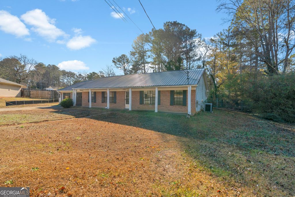 Photo of 1999 Sewing Circle, Lithonia, GA 30058 (MLS # 10660494)