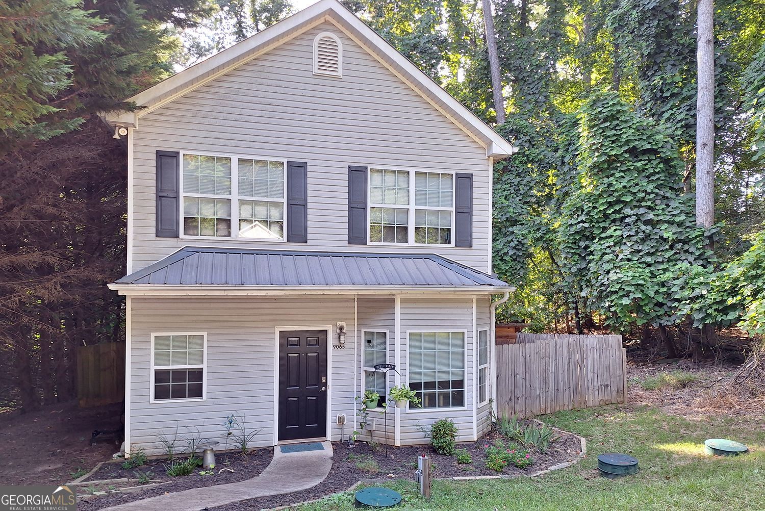 || FENCED BACKYARD || || RADIANT BARRIER IN ATTIC (LOWER UTILITY BILLS) || || METAL ROOF || || COMPOSITE DECK || || LOW MAINTENANCE YARD || || NEW MAIN LEVEL VINYL PLANK FLOORING || || UPDATED KITCHEN COUNTERS + BACKSPLASH || || CLOSE TO PORT ROYALE MARINA & LAKE LANIER || ** What You'll See ** Step into a home with FRESH INTERIOR PAINT, NEW VINYL PLANK FLOORING on the main level, and an UPDATED KITCHEN with modern COUNTERS and BACKSPLASH. Upstairs, enjoy a LARGE MASTER BEDROOM, while outside the FENCED BACKYARD and SPACIOUS COMPOSITE DECK create the perfect setting for outdoor living. A METAL ROOF, GUTTER GUARDS, and LOW MAINTENANCE YARD ensure lasting beauty with minimal upkeep. ** What You'll Hear ** Hear the quiet comfort of a PRIVATE FENCED YARD or the laughter of family and friends gathered on the COMPOSITE DECK. Just minutes away, the sounds of LAKE LANIER and PORT ROYALE MARINA bring the energy of lake life to your doorstep, while inside the home, you'll appreciate the calm and peace that comes with thoughtful UPDATES. ** What You'll Feel ** Feel confident with a WATER PRESSURE REGULATOR REPLACED IN 2025 and the RADIANT BARRIER IN THE ATTIC that keeps temperatures balanced and reduces utility costs. The OFFICE/BONUS ROOM on the main level adds flexibility, while the LARGE MASTER BEDROOM upstairs offers a retreat designed for comfort. ** What You'll Experience ** Experience the LAKE LIFESTYLE with PORT ROYALE MARINA and all of LAKE LANIER just minutes away. Convenient access to CUMMING, GAINESVILLE, and DAWSONVILLE connects you quickly to shopping, dining, and entertainment, while coming home means efficiency, comfort, and a home designed to make life easier.