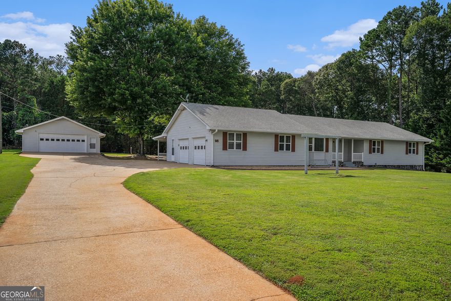 Charming 3-Bedroom Ranch on Over an Acre in McDonough    Welcome to this well-maintained 3-bedroom, 2.5-bath ranch home situated on a spacious and level lot in McDonough. This property offers a perfect blend of comfort, functionality, and potential.    Step inside to a generously sized, updated kitchen complete with granite countertops, stainless steel appliances, and ample cabinetry, followed by hardwood floors that add warmth and charm. The spacious living room features a wood-burning stove that adds character to the heart of the home.    The master bathroom has been thoughtfully renovated with a modern touch, including double vanities and a walk-in shower. A cozy sunroom provides the perfect spot for morning coffee or afternoon reading.    Car enthusiasts or hobbyists will love the attached 2-car garage plus an additional detached 2-car garage with a bonus workshop-perfect for car projects, woodworking, or extra storage.    Enjoy the outdoors with over an acre of flat, usable land offering plenty of space for gardening, play, or expansion. With just a few cosmetic updates, this home offers endless potential to make it truly your own.    Don't miss this incredible opportunity in a desirable McDonough location!