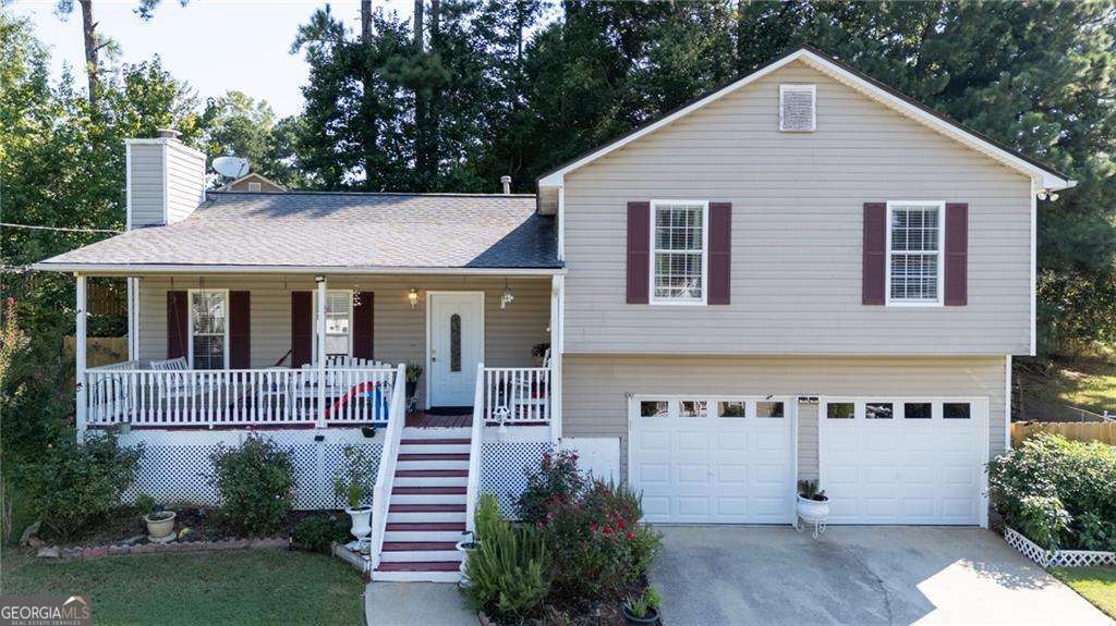 Step into this well-maintained 3-bedroom, 2-bath home where comfort meets convenience. The family room, anchored by a charming fireplace, offers a warm retreat, while the covered rear porch extends your living space outdoors-perfect for morning coffee or evening gatherings. The charming interior offers durable tile and luxury plank flooring throughout. Practical updates bring peace of mind, with a roof just 2 years old, HVAC system approximately 5-6 years old and new insulated garage doors. Tucked in a desirable location, this home is only minutes from conveniences and downtown. A move-in ready gem!