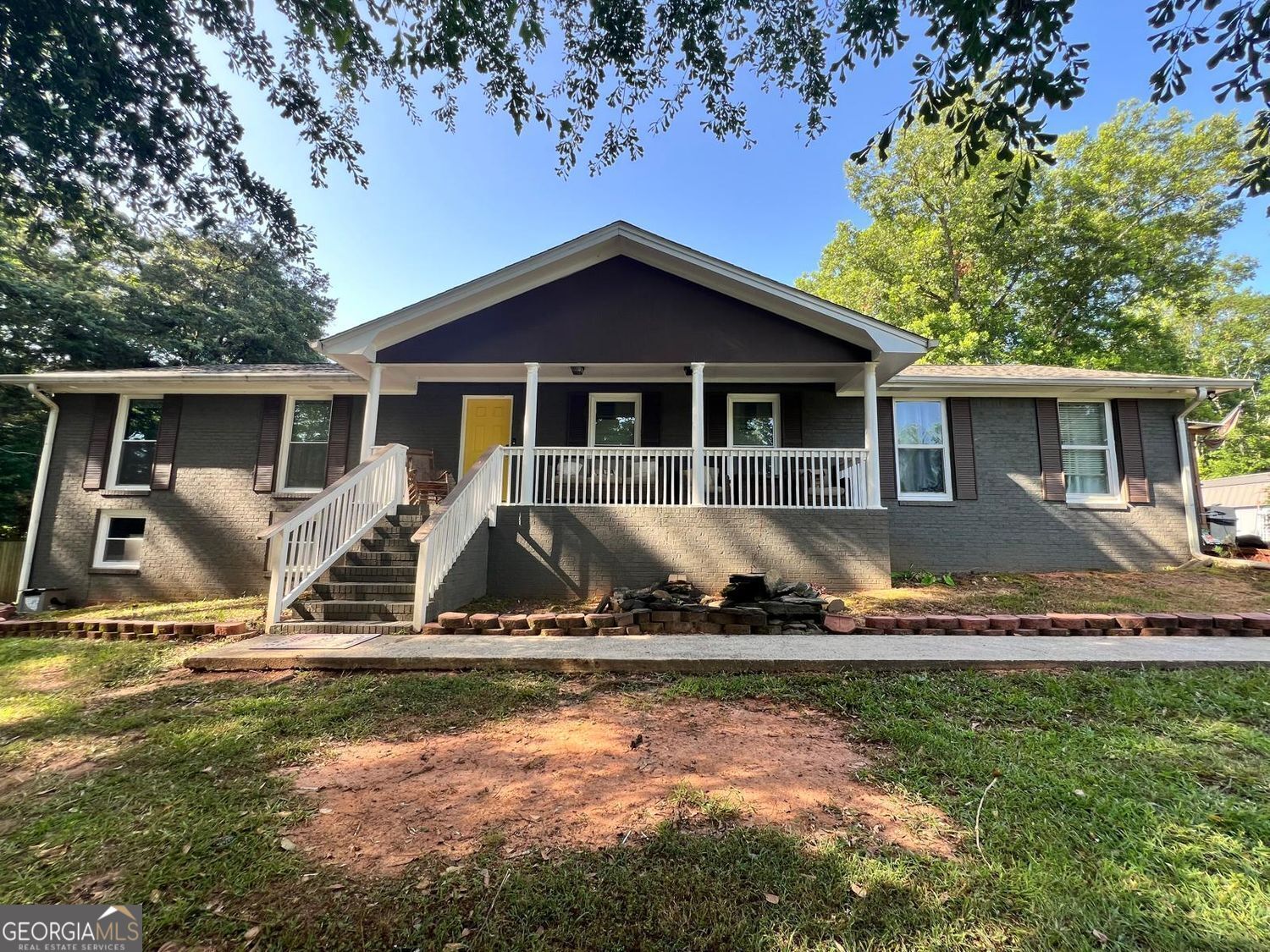 Imagine waking up each day on nearly two acres of peaceful land, where the charm of country living meets the convenience of nearby amenities. Tucked away just off Lake Jodeco Road, this all-brick ranch offers the space, freedom, and flexibility you've been searching for-without the restrictions of a subdivision. Whether you're dreaming of building out your garden, parking your RV, or finally building that custom workshop, this property makes it all possible. Step inside and you'll feel the warmth of hardwood floors stretching throughout the home. The kitchen features sleek stainless steel appliances. A spacious side porch, added in 2015, invites you to unwind with a ceiling fan overhead and views of your sprawling, fenced backyard. Both bathrooms were remodeled. This thoughtfully designed home offers three bedrooms, two full bathrooms, and a unique office or homeschooling nook with custom floor-to-ceiling bookshelves-perfect for remote work, creative projects, or quiet study. Downstairs, the full basement is a blank canvas, with one finished 12x10 room and another partially complete space, giving you room to grow, entertain, or store all your tools and toys. The roof was replaced in 2023, and the A/C unit was newly installed in 2024, providing peace of mind for years to come. Whether you're looking to start a mini farm, enjoy private outdoor living, or simply want space to breathe, this home is a rare find in today's market. Don't miss this opportunity to own a versatile property with endless potential.