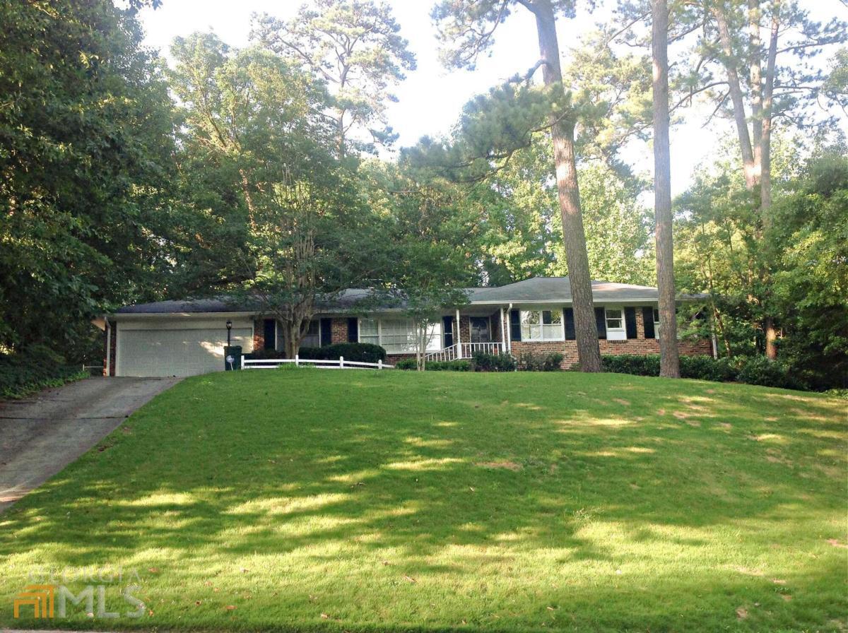 Best of the old/new on one-half acre! Owners added onto home with amazing renovations. Huge, impressive great-room has perfectly placed dramatic window with view of rare private/wooded backyard. Owners worked hard to keep vintage character- rustic hardwoods/original masonry fireplace, numerous custom built-ins. Master w/attach bath. Kitchen/ baths renovated. Fully finished basement with rec room, three addCOl rooms PLUS unbelievable amt storage. Fenced yard. Patio plus deck.