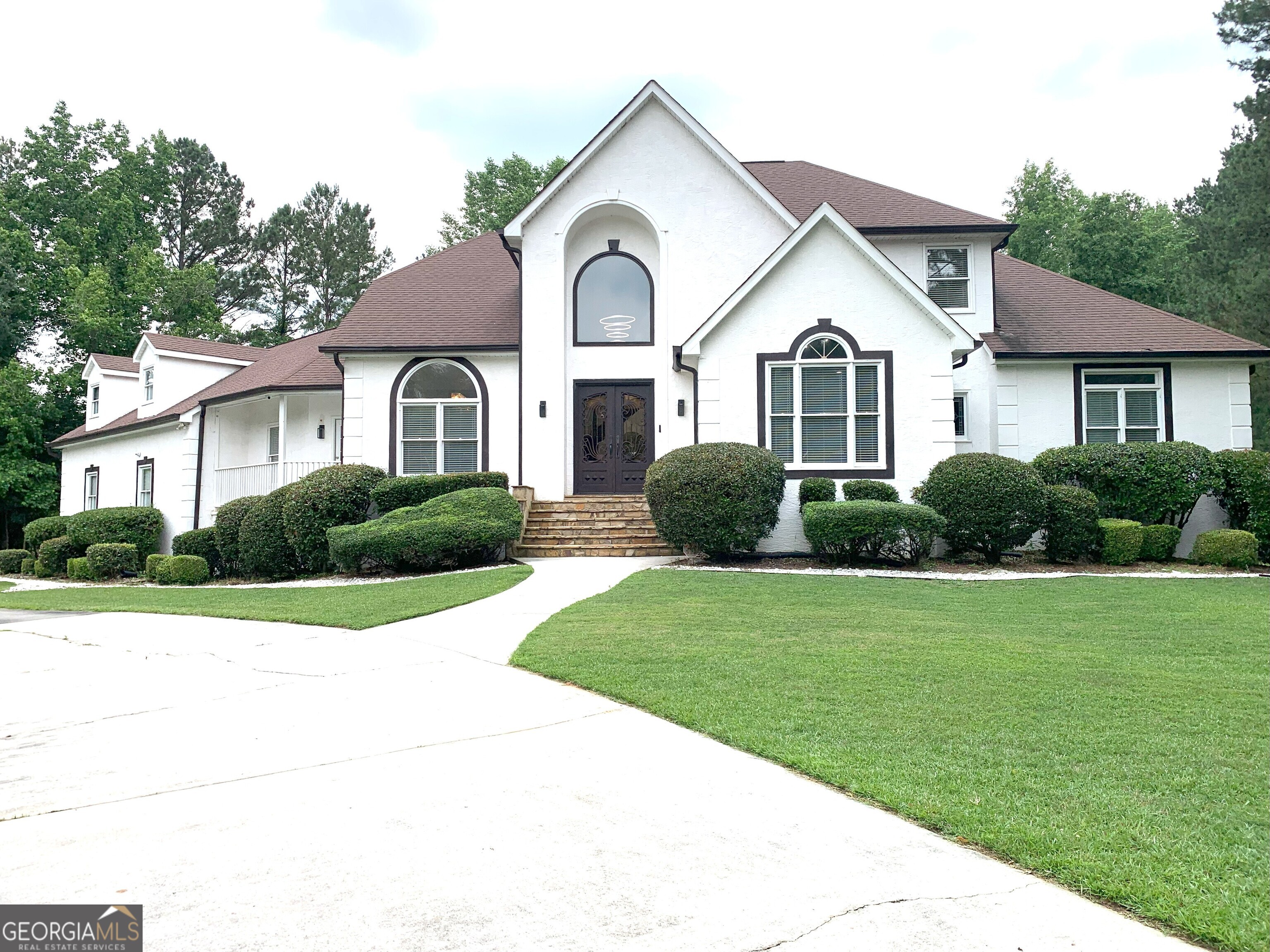***Showings are on this Friday, May 20th from 1:30pm-4pm. Please use showingtime or call Trisha directly at 678-615-0549***Discover the elegance in this stunning 7-bedroom home with 4-car garage, nestled within one of Fayetteville's most desirable communities. *Must See!* Best of all, there's no HOA! ***PLEASE DO NOT APPROACH PROPERTY WITHOUT AN APPOINTMENT** This exceptional property offers three levels of exquisite living. Over 1 Acre of Land. The main floor boasts elegant white venetian tile flooring, while the upper level features beautiful real hardwood. You'll find a convenient master suite on the main level, complete with his-and-hers walk-in closets and a spacious trey-ceiling master bathroom. The bright and airy family room features soaring high two-story ceilings and a charming two-way fireplace that it shares with the kitchen. The heart of the home is the large family kitchen, featuring an expansive island and original wood cabinetry. A fantastic bonus in-law suite with a full bathroom offers flexibility. Upstairs, a sitting room or bedroom-sized loft area connects to two bedrooms, each with its own private bathroom. The fully finished basement is an entertainer's dream, offering four bedrooms (two currently transformed into a movie theater and lounge), a full kitchen, and an oversized island. Outside, the expansive driveway wraps around the property, leading to a private backyard oasis. This driveway can accommodate up to 20 vehicles. A large gazebo, equipped with a full kitchen including a grill, TV, and lounge areas, is perfect for hosting gatherings. The backyard provides a tranquil retreat, bordered by the serenity of the woods. *****This remarkable home is being offered fully furnished with a strong offer.***** Up to $2,500 towards buyers closing costs with Preferred Lender. Also up to $15,000 in Closing Costs/Down Payment Assistance with Preferred Lender. Plenty of space for everyone. FHA, VA, Conventional, Cash, Lease Purchase Programs Available. -Georgia Platinum Mortgage-Therese Upshaw-678-591-1358- Ask Therese how you can qualify for under 4.50% Interest rates. Lease Purchase Programs Available. Call Trisha Spicer for questions or showings - 678-615-0549. Send Offers to: thespicerteam@gmail.com