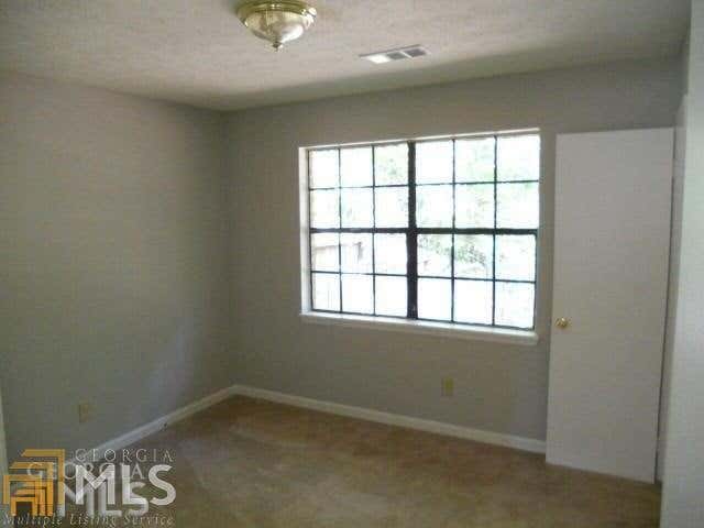 Photo of 2384 Rodgers Drive SE, Conyers, GA 30094 (MLS # 10823492)