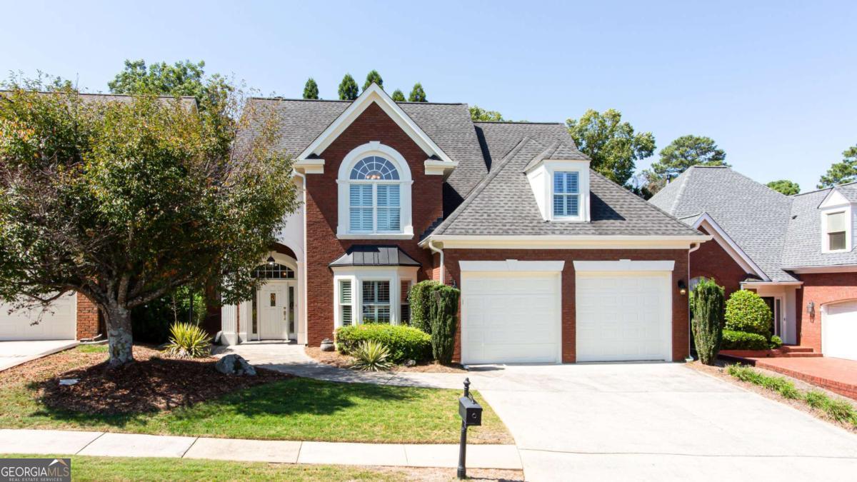 Stunning 4-Sided Brick Home in a Gated Community. Located in one of the area's most sought-after gated neighborhoods and top-rated school districts, this home blends timeless charm with modern upgrades. The main level features a spacious primary suite with dual closets, a relaxing jacuzzi tub, and a separate shower. The elegant family room boasts a hand-painted fireplace, while the gourmet kitchen offers granite countertops, custom cabinetry, and upscale finishes throughout. Upstairs you'll find two oversized bedrooms connected by a shared bath, each with private sink areas, plus a large bonus room perfect for a 4th bedroom, home office, or recreation space. Plantation shutters and designer decor elevate every room. Step outside to your private oasis-a gorgeous, level backyard with a pergola, serene pond, and covered patio ideal for entertaining or quiet relaxation. All just minutes from top schools, shopping, dining, and the hospital-this home truly has it all!
