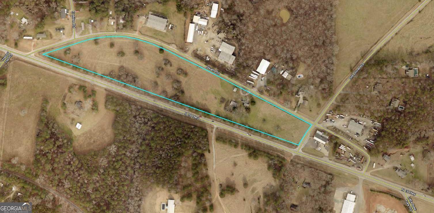 Good Tract for development between Carrollton And Newnan. Total of 12 Acres... Would make a great retail strip center or Convenience Store corner. Possibly a Storage facility, Road frontage on all sides of property. Currently has a small 2 br House and shop on property.