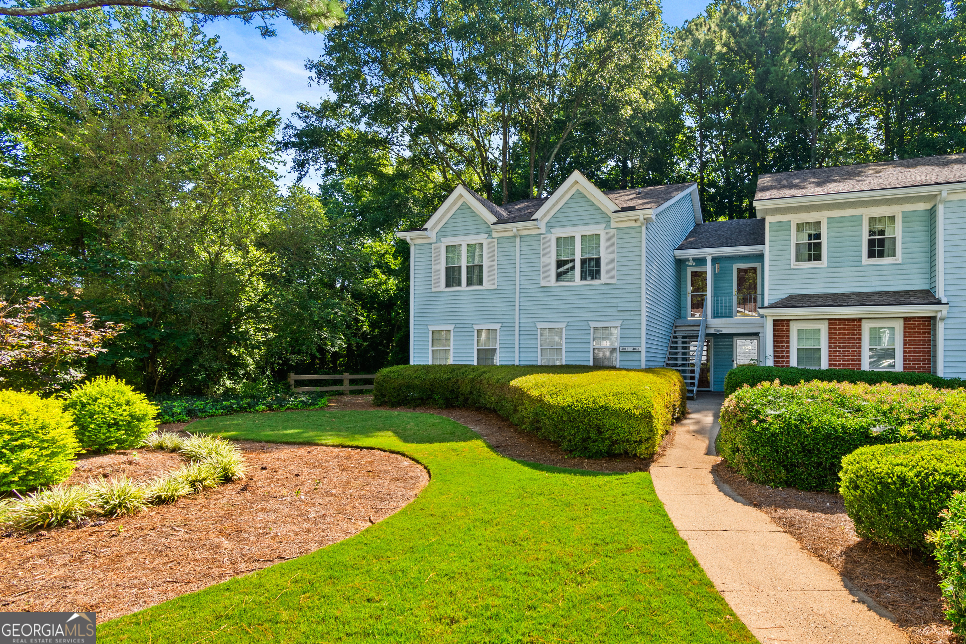 Welcome home to this amazing updated 2 bedroom and 2-bathroom home located in one of Alpharetta's most desirable neighborhoods. Beautifully maintained home, ready to move into. Laminate and tile flooring throughout. No carpet here! Inviting entry foyer leads into the fireside family room which features sliding glass doors to the oversized deck with storage room overlooking the private and wooded back yard. Separate dining room. Updated kitchen with an abundance of wood cabinetry, granite counter tops, refrigerator, gas stove, microwave, dishwasher and walk-in pantry. Owner's retreat features a large bedroom, laminate flooring, 2 closets, 2" white blinds, tiled bathroom, custom vanity. Guest bedroom has laminate flooring, 2" wood blinds. Guest bathroom with tiled flooring, custom vanity. Washer and dryer in the laundry room. Lots of natural light throughout, open and bright floor plan, double pane windows, lots of closet space. No one above you!!!!!! Ample parking for residents and guests, A swim/tennis neighborhood. Just minutes to downtown Alpharetta, The Avalon, North Point Mall, The Greenway, Windward Pkwy, Ameris Amphitheater, dining, shopping, Alpharetta Arts center, and easy access to GA400. Top schools.