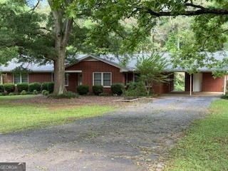 Well kept 4 br 2 ba home in the country. Lawn care is included in rent . This property has a 2 car carport and is on well water. NO smoking And NO Pets. All tenants 18 and older must submit to a criminal and credit background check. Must have a 600 or higher credit score.