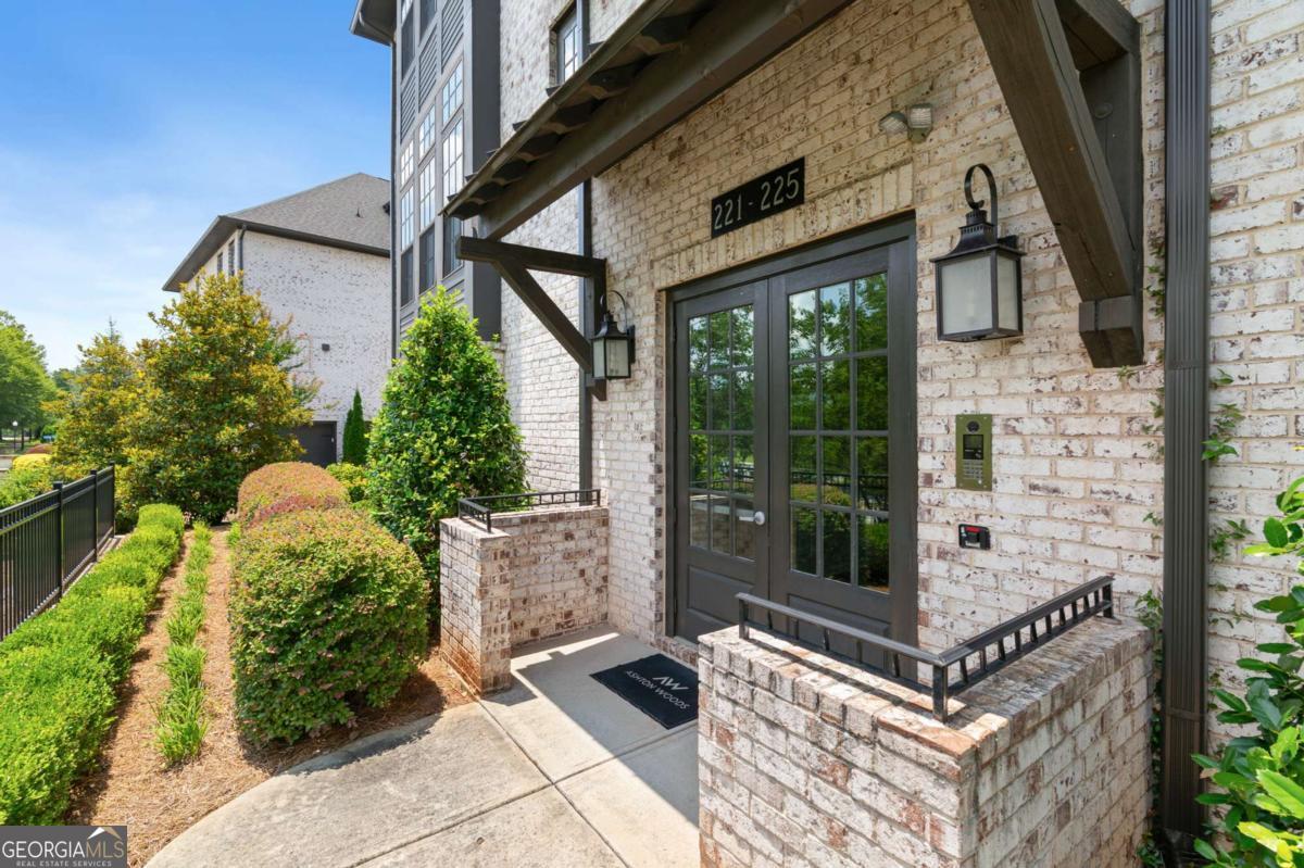 Welcome to this stunning 1-bedroom, 2.5-bathroom condo located in one of the most highly sought-after communities and school districts. This beautifully maintained, move-in ready home combines style, space, and functionality, perfect for comfortable living and effortless entertaining. Step into a bright and spacious kitchen featuring sleek white stone countertops, a large island with breakfast bar seating, stainless steel appliances, and an inviting eat-in area-perfect for casual meals or morning coffee. Just off the kitchen, enjoy a private porch ideal for relaxing or entertaining outdoors. The oversized primary suite is a true retreat, offering ample space, a spa-like en-suite bath with double vanities, a glass walk-in shower, and an expansive custom walk-in closet with thoughtfully designed built-ins. An additional full bathroom also features a stylish glass walk-in shower, adding convenience for guests or potential office use. This unit includes a dedicated 2 car garage, as well as an in-unit washer and dryer for added ease and efficiency. The community is beautifully landscaped and meticulously maintained, offering a tranquil setting to come home to each day. Whether you're a first-time buyer, downsizing, or looking for a turn-key investment in a top-tier location, this condo offers comfort, convenience, and timeless style. Schedule your showing today!