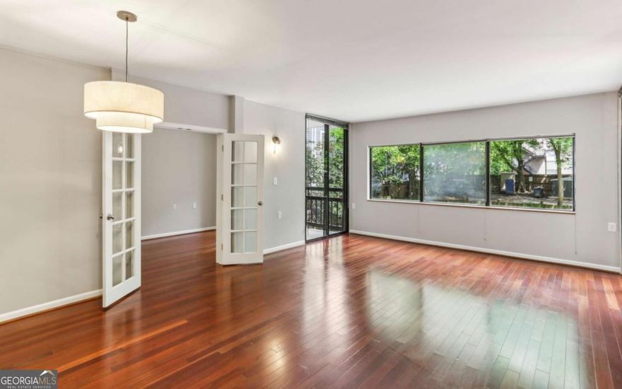 Location, location, location! Nestled right in the heart of Midtown Atlanta at the coveted intersection of 13th and Piedmont, welcome to Ansley Above the Park-a place where elegance meets comfort. This sought-after building doesn't just offer a home; it provides a lifestyle with ample guest parking and secure underground parking for residents.    As you step inside, you're greeted by a welcoming 24-hour concierge, ensuring peace of mind in this highly secured building equipped with a modern FOB system and guest sign-in for added security. With several inviting common areas, including a club room, pool deck, gym, and an 11th-floor terrace offering breathtaking views of Piedmont Park and the Botanical Gardens, you'll find it hard to leave home.    This rare unit is a true gem. An updated kitchen with rich dark wood cabinets and stainless steel appliances. Freshly painted. Recently renovated bathrooms, a newer HVAC system (less than five years old). New carpet in one bedroom, hardwood and tile in the rest of the unit.     The open layout is perfect for working from home, hosting friends or simply enjoying a cozy night in. Plus, being on the same floor as the clubroom, gym, and pool means you have world-class amenities literally at your doorstep. Whether you're sweating it out in the fitness center, taking a dip in the pool, or entertaining in the clubroom, everything you need is right here. This unit also comes with an assigned storage unit. The building has access to charge for EVs.    And let's not forget the unbeatable location! Across the street from Piedmont Park, you'll have access to lush greenery, exciting recreational activities, seasonal markets, concerts, and festivals. Easy access to the Beltline for those morning or evening runs. Midtown's vibrant cultural attractions, diverse restaurants, and buzzing nightlife are all just a short walk away, including Ponce City Market, Trader Joes, and Publix, making this the perfect spot for an urban dweller.    Welcome home to Ansley Above the Park. Schedule your private tour today and discover why this remarkable property should be your next address.