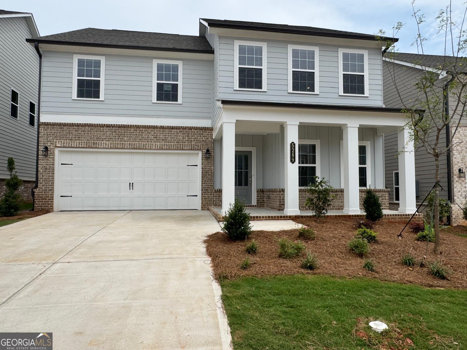 Welcome to this stunning 5-bedroom, 4-bathroom home in the sought-after Eastlyn Crossing community. The spacious Pearson floor plan offers 2,801 sq. ft. of thoughtfully designed living space featuring a main-level guest suite, a private study perfect for a home office or formal dining, and an open-concept kitchen with white cabinetry, designer tile backsplash, and stainless steel appliances. Enjoy natural light throughout the expansive family and breakfast areas, with direct access to a covered patio ideal for outdoor relaxation. Upstairs, the luxurious Primary Suite includes a trey ceiling, spa-inspired bathroom with tile shower and dual vanities, and a large walk-in closet. Three additional bedrooms, two full baths, a laundry room, and a versatile loft complete the upper level. Located in the heart of Flowery Branch near Lake Lanier, Eastlyn Crossing offers community amenities including a pool with cabanas, pickleball courts, and proximity to parks, golf, hiking, shopping, and dining in historic downtown Flowery Branch. Don't miss this opportunity to lease a beautiful, modern home in a vibrant, amenity-rich neighborhood.