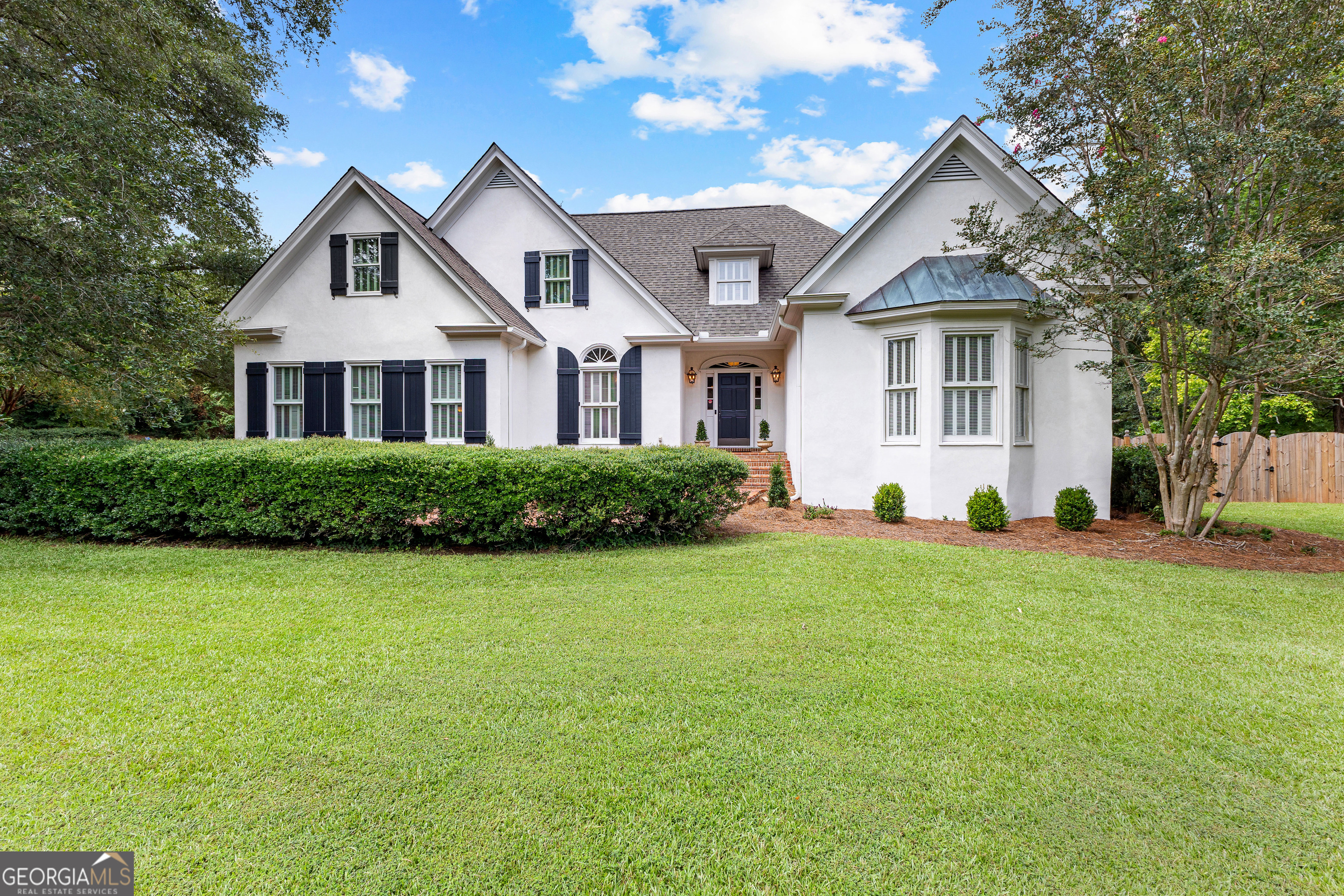 Stunning Custom Home with Exceptional Features - A True Showstopper! Welcome to this recently renovated masterpiece, where quality and design excellence are seamlessly woven throughout every inch. Upon entering the inviting foyer, you'll immediately be captivated by the rich, refinished heart pine wood flooring that flows across the main level of the home. At the heart of the home is the spacious Family Room, perfect for entertaining and relaxing, complete with a gorgeous fireplace-ideal for cozy Fall evenings. Adjacent to this is a bright and airy Study, featuring a large bay window that allows natural light to enter the space, complemented by custom built-in cabinetry. On the opposite side of the Family Room, you'll discover a kitchen that blends character, quality, and functionality. The kitchen showcases natural stone flooring, custom cabinetry offering ample storage, soapstone countertops, a tongue & groove backsplash, a striking custom vent hood, and high-end designer appliances. Enjoy breakfast in the delightful breakfast nook, where large windows offer a serene view. A formal Dining Room offers the perfect setting for hosting special meals, while a cozy Den off the Kitchen features designer carpeting, a coffee bar, and extra storage. At the rear of the home, a spacious sunroom overlooks the expansive, fenced backyard-a wonderful space to unwind after a long day. The luxurious Primary Suite is a true retreat, offering vaulted ceilings, large windows, and its own private fireplace. The marbled en-suite bathroom features French antique dual vanities with soapstone countertops, dual wardrobes for linen storage, a freestanding tub, and a separate walk-in shower. Upstairs, you'll find three generously sized bedrooms that share a spacious, well-appointed bathroom with dual vanities and a separate water closet. Additionally, a large, walk-in attic offers excellent storage and the potential to be finished into additional living space. Step outside into the beautiful covered courtyard, leading to a brick paver patio-perfect for dining and entertaining. The multi-purpose structure in the backyard offers endless possibilities, from a workshop to an art studio or home office. This gorgeous home is located in the highly sought-after Hollis Hand Elementary / LaGrange High School district and is just minutes away from Downtown LaGrange (4 miles), Highland Country Club (1.5 miles), and West Point Lake (2 miles). Don't miss the opportunity to call this exquisite home yours!