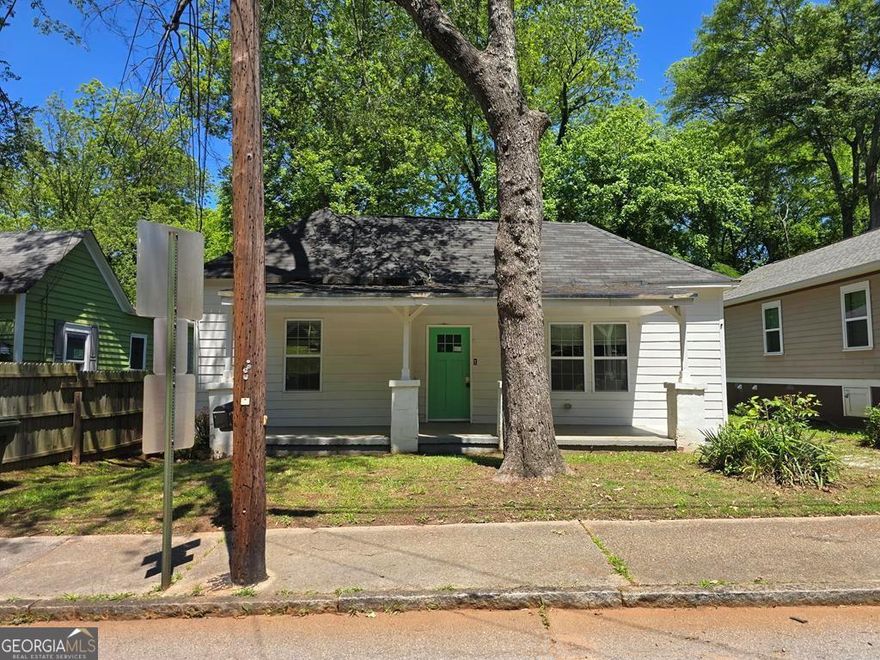 On this quiet street drive up to this charming cottage home with, large front porch! Ready for sitting on summer days & nights! The bedrooms are large & have high ceilings! Kitchen has plenty of counter space and an arched doorway! The primary bathroom has double vanities! The large yard boasts a deck just ready for entertaining, and an additional storage shed! There are community parks nearby.