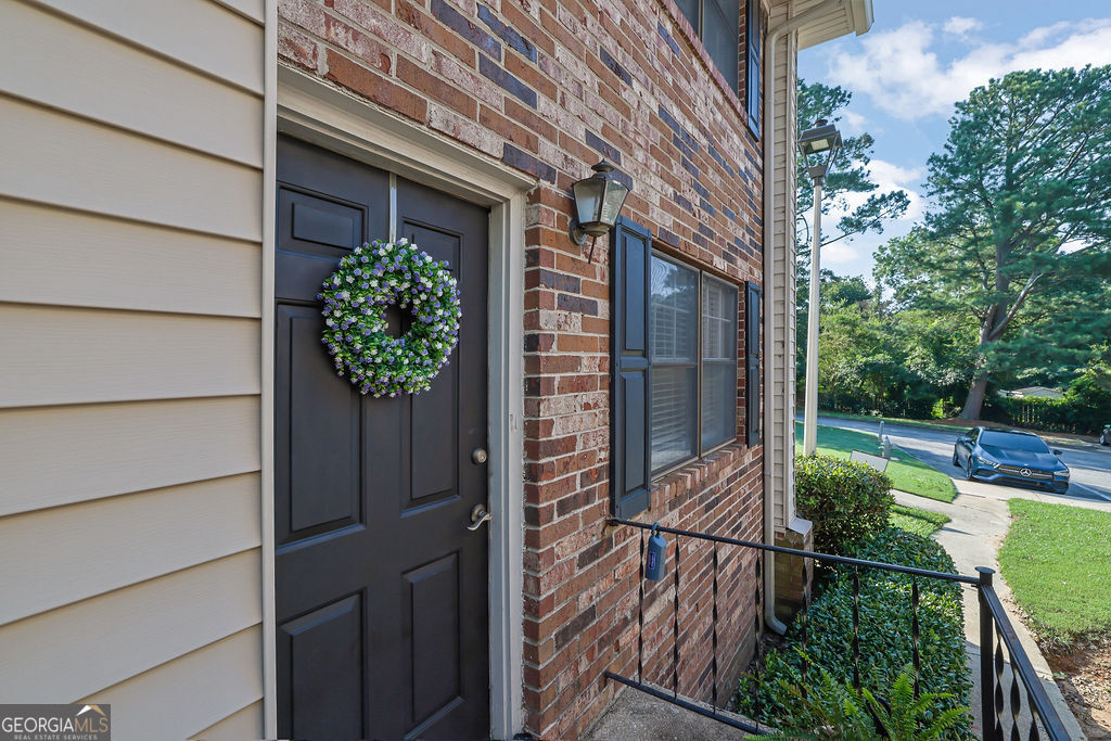 Step into this bright and welcoming 2-bedroom end-unit condo, perfectly situated for both convenience and comfort. Enjoy your own private patio and a short stroll to the community pool for relaxing weekends. The main level features a functional kitchen, cozy dining nook, spacious living room, half bath, and laundry closet. Upstairs, you'll find two comfortable bedrooms and a full bath with a whirlpool tub/shower combo-perfect for unwinding after a long day. You'll love being just minutes from downtown Gainesville, I-985, Northeast Georgia Medical Center, shopping, dining, parks, and more. Major updates include new HVAC and flooring (2020) and fresh interior paint (2022)-move-in ready and waiting for you! The following are included as part of the HOA: water, trash, lawn care, and exterminator.