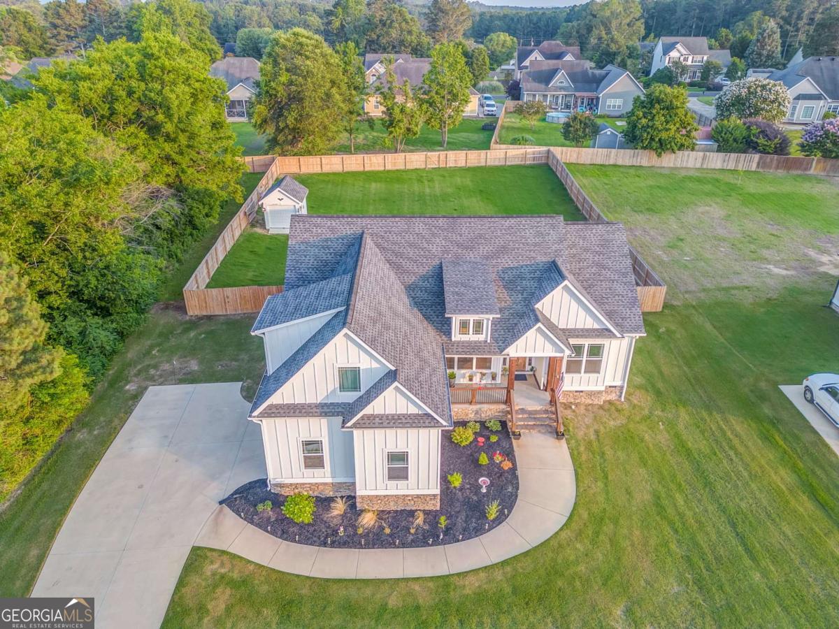 Exquisite 4-bedroom, 2-bath custom home built in 2022 on over half an acre in the sought-after Battle Farm neighborhood within the Armuchee School District. Recent updates include new appliances, new flooring, fresh sod, a fenced backyard, and a newly added workshop. With 2,200 sq. ft., high ceilings, custom cabinets, and an open floor plan filled with natural light, this home blends comfort and style. Move-in ready, with the seller possibly including furnishings-don't miss this opportunity!