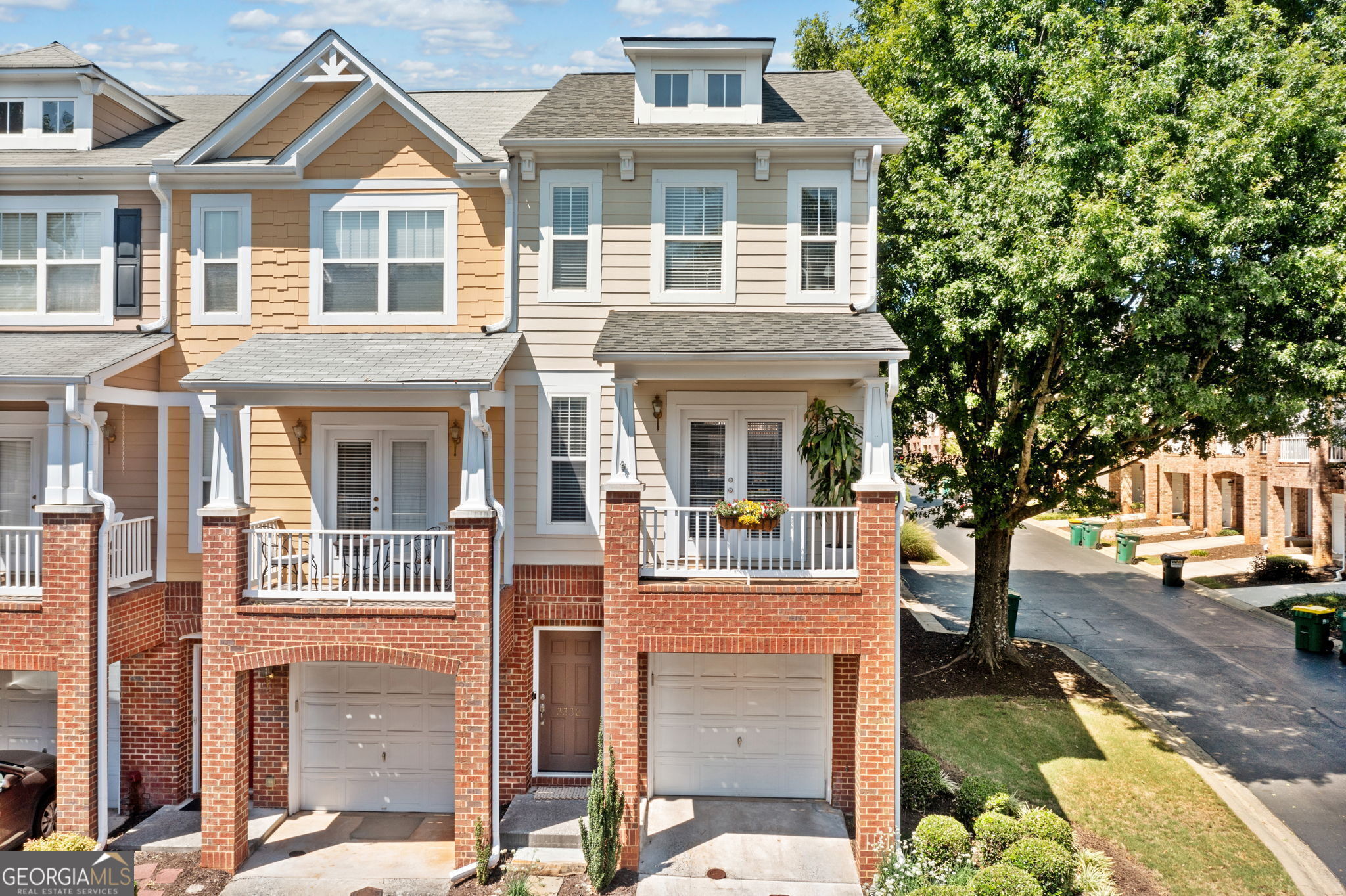 Location! NEW DECK, NEW ROOF, UPDATED KITCHEN AND END UNIT.  Welcome to Wyndham! Nestled in the heart of Alpharetta/Milton and close to a host of places to enjoy. This 2 Bed/2.5 Bath is an ideal choice for those seeking a dynamic live-work-play lifestyle. Whether you are drawn to the allure of specialty shopping and dining, the tranquility of nearby trails, or the seamless integration of living spaces, this residence is ready for you to call it home.  All bedrooms have their own private bathrooms plus a half bath on main.  The recently UPDATED eat-in kitchen welcomes all with a dining space, breakfast bar, quartz countertops and stainless-steel appliances. The upper level resides the owner's suite, secondary bedroom, and laundry. This END unit has abundant natural light.  Private living area downstairs with access to a patio.  Outdoor living galore! The main level has a covered porch at the front and a NEW deck with privacy fence in the rear. Roof REPLACED in 2020. Enjoy access to the community pool, playground, and firepit. Top rated schools, ease of access to GA-400, local shopping centers, biking trails, Big Creek Greenway and lifestyle venues such as The Avalon and Halcyon, and much more make this area one to want to be a part of.