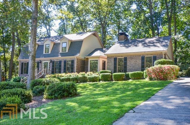 Majestic & meticulously maintained home in Camp Creek/Parkview school district. 5 bedrooms, 4 full baths includes full in-law suite in basement. Updated kitchen with gorgeous granite countertops, stainless steel appl., island & workstation. All bedrooms are oversized. One bedroom/full bath on main level. Sep. DR & LR have hardwood floors. Oversized FR w/masonry fplc & built in bookcases. Freshly painted interior. Sunroom with unique pebble stone flooring & wet bar. Dual sinks in master bath. Bsmt has in-law suite with full kit., bedroom, bath & media or 2nd family rm.