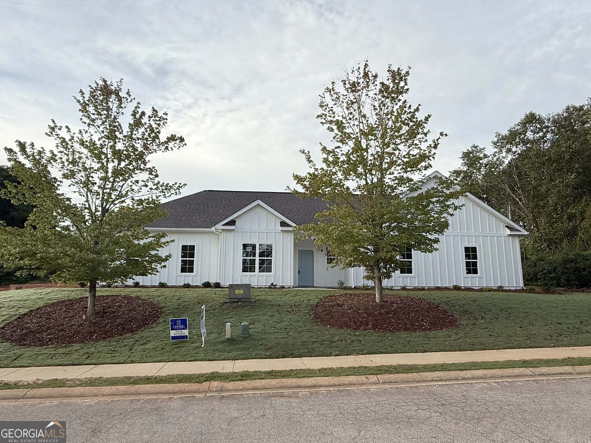 IN-TOWN LOCATION & MOVE-IN-READY!! The Lulu floor plan is a smart, functional layout that makes everyday living easy. Located in Creekside, just 2 miles from downtown LaGrange and within the LaGrange High School zone, this home offers both convenience and comfort with 1,652 sf of living space. The exterior features board-and-batten fiber cement siding for durability and style, along with a side-entry garage that enhances curb appeal. Inside, the foyer leads into a dining area that flows right into the open family room and kitchen, creating a great space for gathering and entertaining. The kitchen features a central island for extra seating and prep space, along with painted cabinets, granite countertops, and a classic subway tile backsplash. The owner's suite is tucked away in the back for privacy, complete with a walk-in closet and a spacious bathroom featuring a zero-entry custom tile shower with a frameless glass door. Two additional bedrooms share a full bath, making it a great setup for families or guests. This home is designed with Mohawk Luxury Vinyl Flooring in the main living areas for durability and style, while the laundry and bathrooms feature ceramic tile. A rear foyer off the two-car garage leads to the laundry room, adding everyday convenience. Out back, a spacious patio offers a nice spot to relax or entertain. For additional information regarding this new home, please contact our Sales Assistant Tammy at 706-594-2453 today!