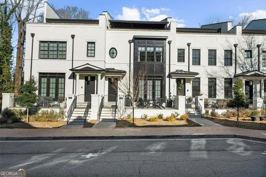 Experience Modern Luxury lifestyle at its finest in the heart of historic Downtown Alpharetta, where you can savor the vibrant atmosphere from your ROOF-TOP terrace, with panoramic views. Minutes from cafes, restaurants, stores, Alpha loop and Avalon, itCOs in an exclusive 14-home enclave with sophisticated design.  This brick Townhouse features AMPLE PARKING space (3 car garage plus 2 cars on your driveway), an ELEVATOR for the 4 levels residence, 4 bedrooms, 4 full baths, 2 powder rooms, 3 outdoor living, offering a seamless blend of elegance and convenience.   Imagine sitting on the inviting front porch to immerse yourself in the Downtown activity.  As you walk in, enjoy the open floorplan with hardwood floors. Entertain in this Chef Gourmet Kitchen featuring glamorous white marble countertops, high end 6 burner Wolf Range, 48COCO Sub-zero Refrigerator/Freezer, a wine fridge with additional cabinets, a walk-in pantry.  Relax in the Fireside living room, with shelves on both side, the open concept dining room, and the sitting area in front of the kitchen. Motorized Silhouette shades on the main are ideal for your privacy.   Entertain on your spacious covered rooftop terrace, featuring a gas firepit complete with an automated retractable awning covering the whole terrace, and enjoy the indoor wet bar with beverage center and ice maker.  Schedule your private tour today!