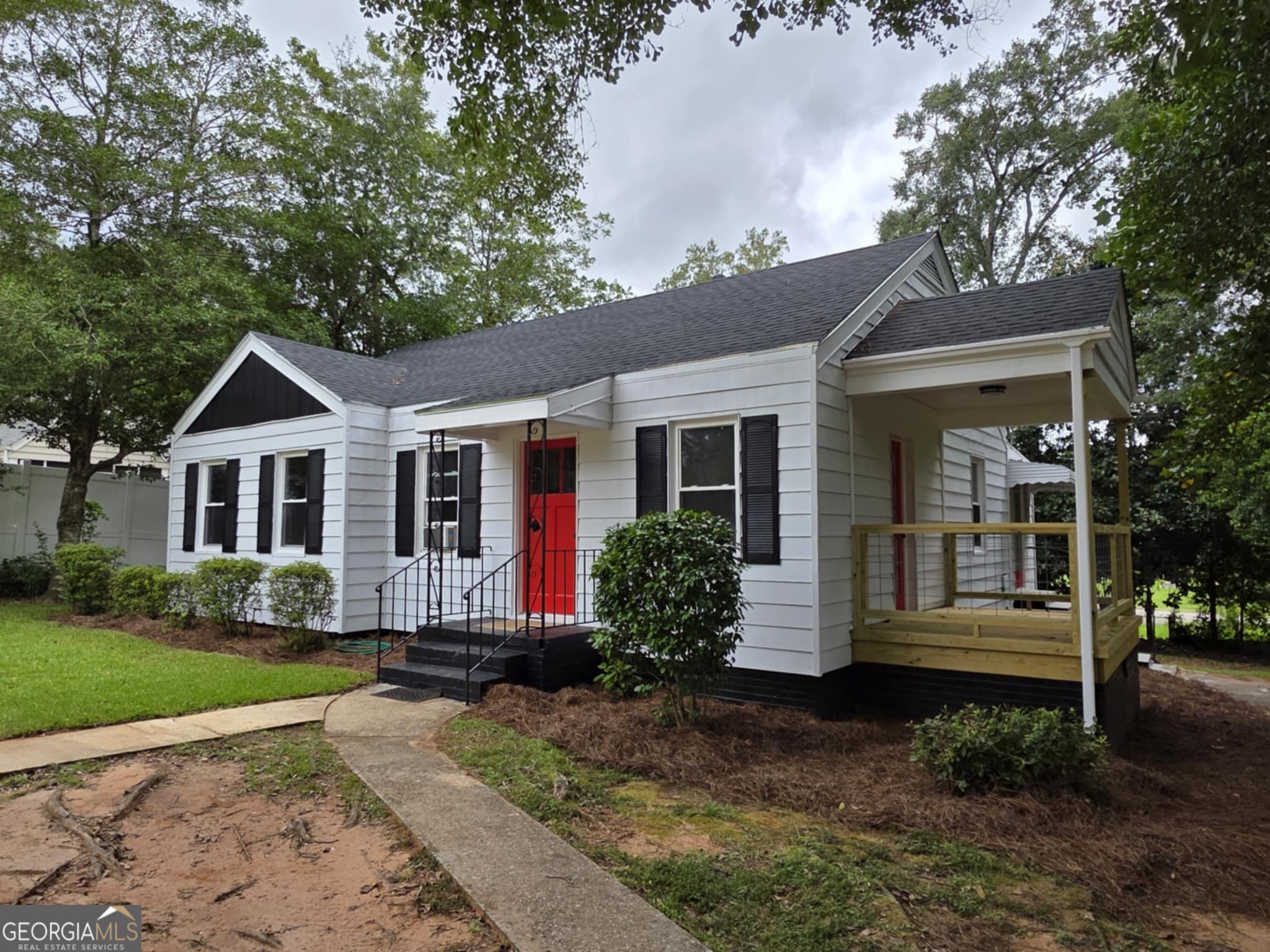 Charming, Renovated Cottage in the Heart of Convenience! This 1,044 sq ft beauty is proof that the best things come in cozy packages! Recently renovated, this 2-bedroom, 1-bath gem features gorgeous hardwood floors, a bright updated tile bath, and a picture-perfect galley kitchen that flows into a quaint dining room. A handy laundry/mud room adds everyday function, while the most adorable side porch is ready for your morning coffee or evening unwind. All of this is just minutes from the downtown district with its amazing restaurants, boutique shopping, and small-town charm.
