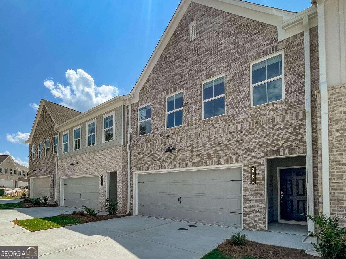 Charming 3-Bedroom Rental Townhouse in a Prime Location This beautiful new construction 3-bedroom, 2.5-bathroom townhouse offers spacious living with modern amenities. Located in a desirable neighborhood, the home is perfect for families or professionals seeking comfort and convenience. As you step inside, you're greeted by an open-concept living and dining area with plenty of natural light, ideal for relaxing or entertaining guests. The well-appointed kitchen features stainless steel appliances, ample cabinet space, and a breakfast bar, perfect for morning meals or casual gatherings. Upstairs, the master suite offers a private retreat with a walk-in closet and an en-suite bathroom with a double vanity. The two additional bedrooms are generously sized with closet space and share a full bathroom. A half-bath on the main floor adds extra convenience. Outside, enjoy a private patio for grilling, outdoor dining or relaxation. The townhouse also includes a garage for two cars, with additional parking available. Located close to shopping, schools, parks, and major commuter routes, this townhouse offers the perfect blend of suburban tranquility and urban convenience. Don't miss out-schedule a viewing today! ***Photos are stock photos of model unit.***
