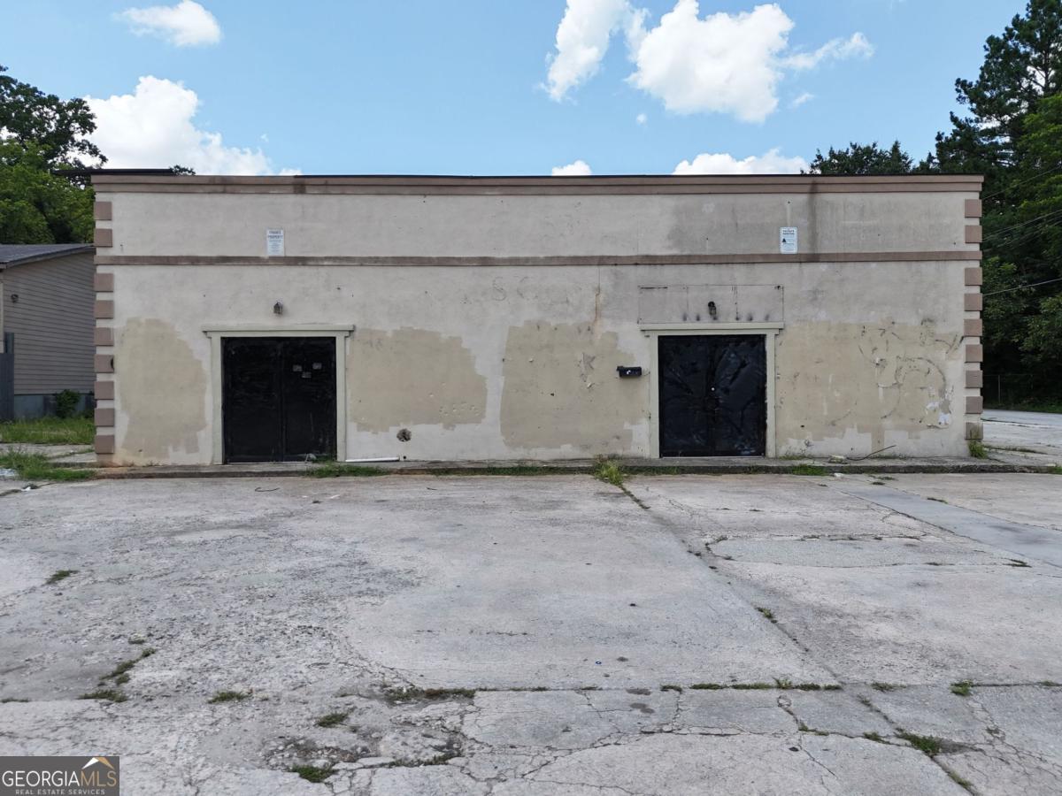 ***Multiple offers received - seller is requesting highest and best by noon (12pm) Friday, August 1st*** Prime westside commercial opportunity, located in the heart of Atlanta's rapidly developing Westside, 2539 Donald Lee Hollowell Pkwy offers a rare investment or owner-user opportunity within both the Hollowell, Martin Luther King Jr. Tax Allocation District (TAD), and a Qualified Opportunity Zone, positioning it perfectly for redevelopment and long-term upside. This vacant commercial property sits on an 8,700 SF lot and includes a 2,900 SF C2-zoned structure primed for a full renovation or buildout. The interior layout features: Three private office suites and two larger flex spaces ideal for shared work areas, reception, or reconfiguration Located less than 2 miles from both I-285 and I-20, the site provides easy access to key transportation routes throughout metro Atlanta. With excellent frontage and visibility along Donald Lee Hollowell Pkwy, and proximity to major westside developments, this property offers strong potential for a wide range of commercial uses including professional services, retail, creative office, or community-focused space. Don't miss this rare opportunity to invest in one of Atlanta's most promising growth corridors. With favorable zoning, opportunity zone benefits, and proximity to major highways and development activity, 2539 Donald Lee Hollowell Pkwy is a strategic acquisition for investors, developers, or owner-users looking to capitalize on the Westside's momentum. Schedule your tour today and unlock the potential of this well-positioned asset. Please Note: The property requires complete rehab. A virtual walkthrough is available and strongly encouraged prior to scheduling in-person tours.