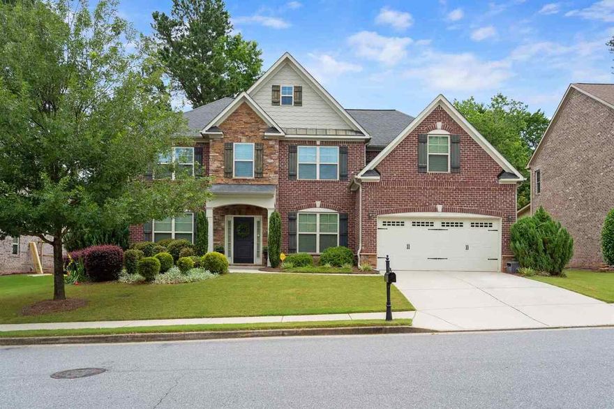 Stunning home in a highly sought after school district Nestled well within the sought after Sentinel Chase community. This 3 sided brick home is close to Shops, GA400,  Hospitals, and Parks. Enter through the welcoming foyer to see on either side the formal Dining Room and Living Room. Soaring ceilings in the Family Room with a custom stone fireplace which keeps it warm in the winter months. The gourmet kitchen features an abundance of cabinet space,  stainless steel appliances, granite countertops, and a large island with enough room for family gatherings.Guest bedroom on Main level with full bath. Inviting Master Suite with a sitting area to enjoy a good book or movie.  Spa like Master Bath. 3 additional Bedrooms on upper level with 3 Full baths. Neutral palette throughout the home. Custom Blinds on all Windows. Beautiful wooded backyard is very private.  This home is a gem!