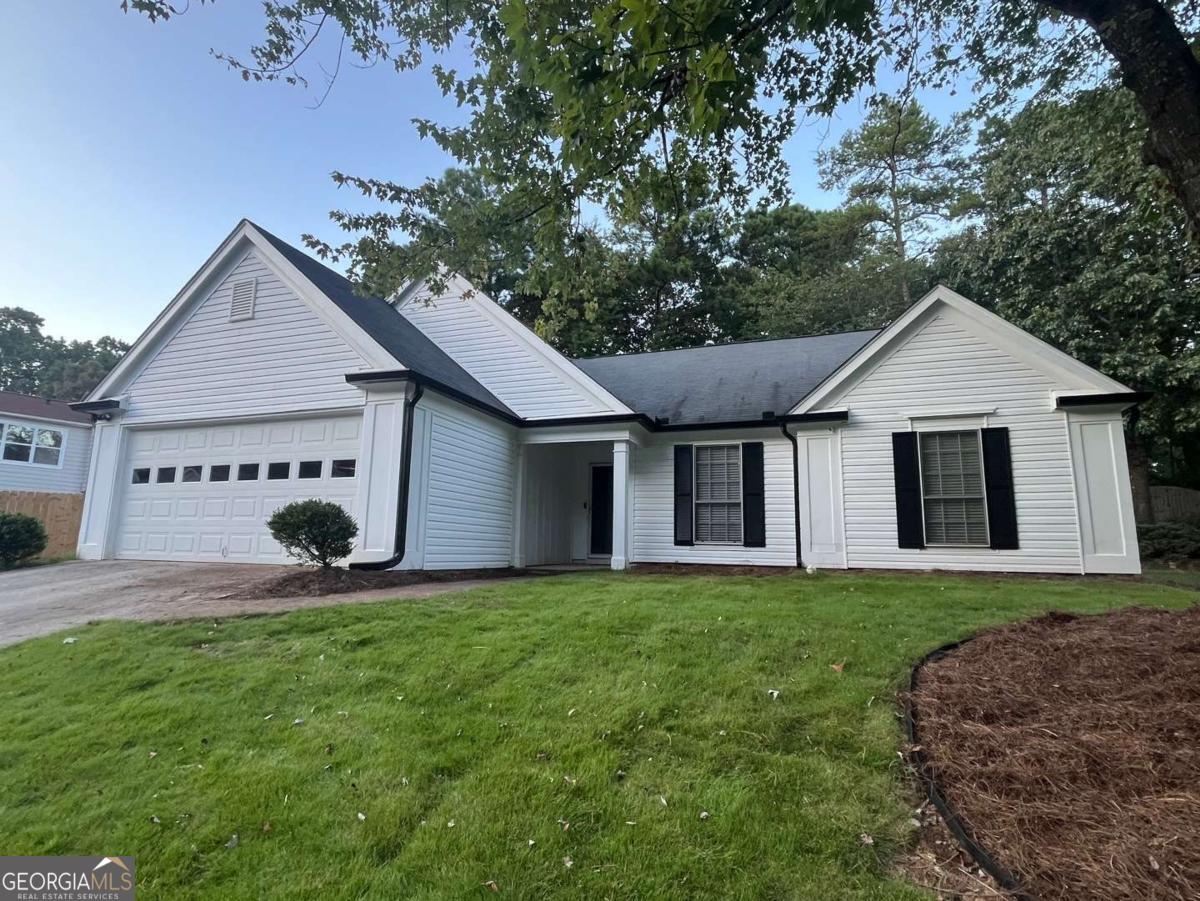 This gorgeous Traditional Ranch Home showcases exceptional craftsmanship. Walk to award-winning schools in the Johns Creek school district. Located in the heart of Johns Creek - named #1 Best Place to Live in the U.S. per USA Today in 2025. The home features 3 bedrooms, 2 baths, and approximately 1,776 sq ft of living space with hardwood, LVP flooring, and is newly painted. Primary bedroom suite features brand new beautiful LVP flooring, new soaking tub, new separate shower with frameless glass, double vanities, and a walk-in closet. There are two other bedrooms with new LVP flooring and a light and upgraded second full bath. The gourmet kitchen has natural light and easy grocery drop off directly from the 2-car garage. There is plenty of cabinet space. There is a separate breakfast room, a formal dining room, a convenient laundry room with washer and dryer next to the kitchen. The family room has a great fireplace - perfect for entertaining. Also featured is an enclosed sunroom for exercise or having your morning coffee overlooking the private backyard. This home is not only walking distance to top-rated schools, but also conveniently close to shopping, dining, golfing, parks, and entertainment. Easy commute, less than 5 miles SE from SR-400, less than a mile W from SR-141, and about 10 miles W from I-85 exit 109. This beautiful home is ideal for family living and is available for lease for 12 months or longer. Landscaping is included in rental price. Preference is given to applicants with a credit score of 700+ and a monthly income at least three times the rent. All applicants over the age of 18 must apply via RentSpree for $49.99 per applicant.