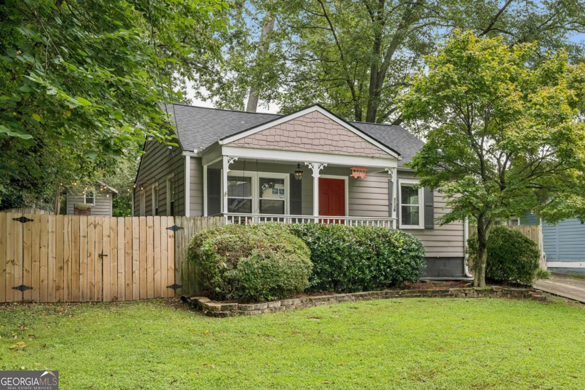 Welcome home to classic charm and modern comfort in one of Atlanta's favorite neighborhoods. This cozy Craftsman bungalow welcomes you with a charming covered front porch, perfect for morning coffee or evening chats with neighbors. Step inside to a bright and airy open-concept living and dining area with gleaming hardwood floors. The kitchen is both functional and inviting, featuring stainless steel appliances, granite countertops, freshly painted cabinets, and an abundance of natural light. The primary suite is delightful, offering a renovated en suite bathroom with dual vanities, a spacious walk-in shower, and a generous walk-in closet. Step out back and you'll find your private outdoor oasis-a wrap-around back deck with plenty of space to relax or host, including room for a 12+ seat picnic table. The brick fire pit, two-tiered backyard, gardening beds, and upper patio pad make this space as functional as it is beautiful. Enjoy the lush lawn and summer nights, all within the comfort of your fully fenced yard. Perfect for a few furry friends! Additional features include a brand-new roof installed in March and a location that's hard to beat. Just around the corner from Woodland Gardens Park and playground, and less than a mile to the Southside Beltline Trail, with easy access to East Atlanta Village, Grant Park, Zoo Atlanta, and more. Come discover the charm, warmth, and lifestyle that this Ormewood Park gem has to offer!