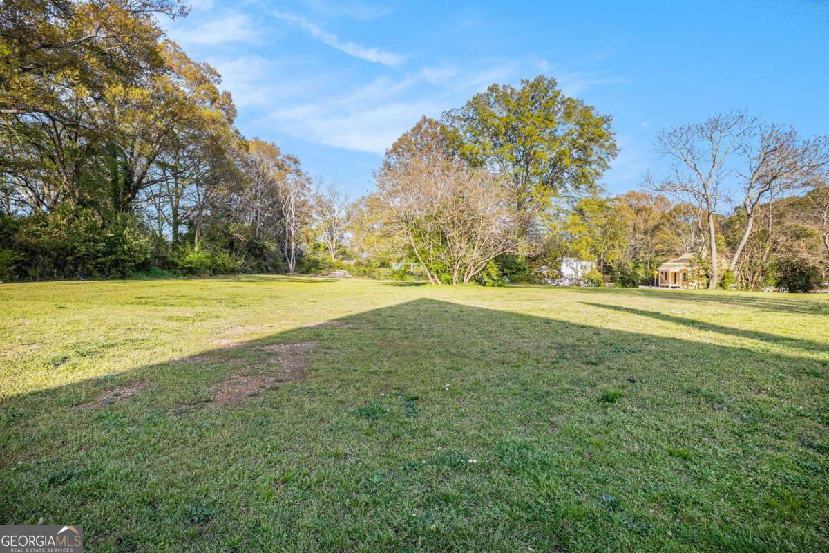 This 1.02-acre lot at 0 Davis Street offers an incredible opportunity for both commercial and residential development. Currently zoned B2 Commercial, the property can be easily rezoned for residential use, providing flexible options for your next project. With essential utilities including sewer, electricity, water, and gas already available, this lot is ready for immediate development. Whether you envision a thriving commercial space or a charming residential community, this property is the perfect canvas to bring your ideas to life. Conveniently located within walking distance to downtown Monroe, you'll enjoy easy access to shops, restaurants, and local amenities, making it an ideal spot for development that benefits from the vibrancy and growth of the area. This is a prime location with great potentialCodonCOt miss out on the opportunity to build in this desirable, accessible area!