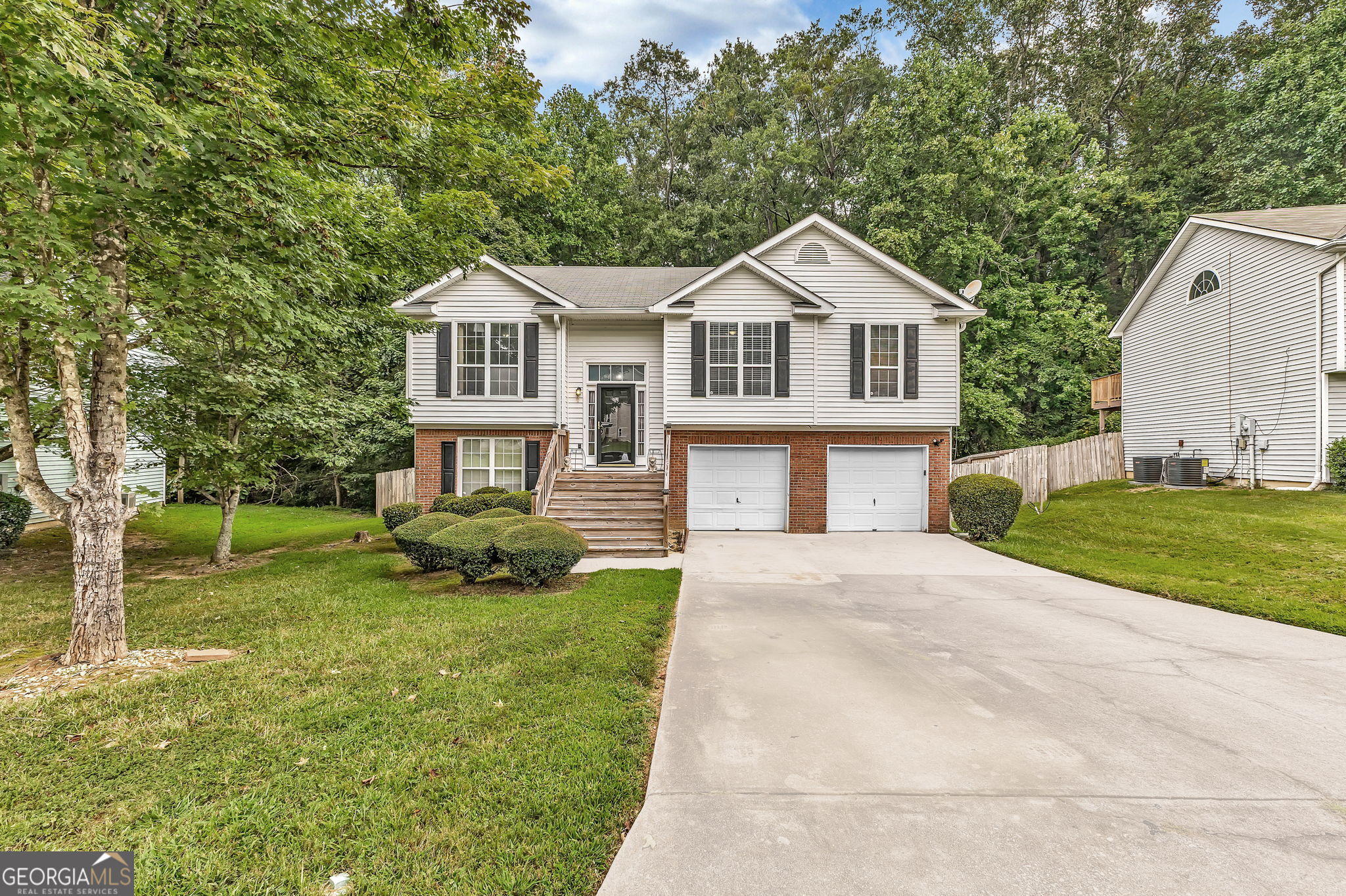 Welcome to this spacious 4 bedroom, 3 bath split foyer home located in the heart of Southwest Atlanta. Main Level Features: Open and airy vaulted living room with fireplace, Separate dining room and eat-in kitchen - perfect for gatherings, 3 bedrooms and 2 full baths, including a spacious owner's suite with tray ceiling, walk-in closet, and private bath featuring a double vanity, separate tub, and shower. Lower Level Features: include 1 additional bedroom and full bath - ideal for guests, in-laws, or home office, 2-car garage with ample storage. Outdoor Space: Fenced backyard for privacy and recreation