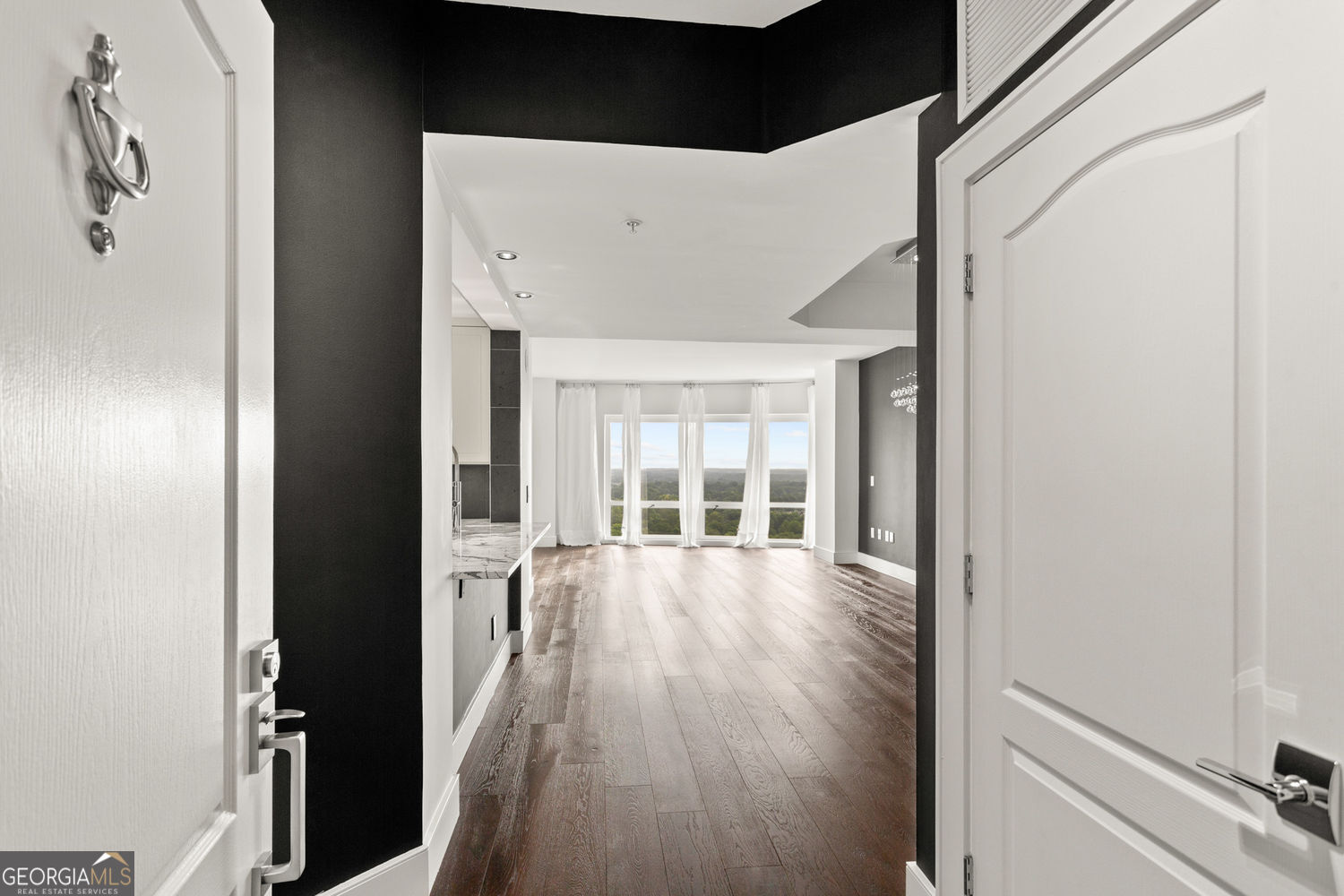 Live in this gorgeous one-of-a-kind condo on the 25th floor at the Oaks of Buckhead, a secure building with elevator key fob access and 24-hour concierge. Walk to high end dining and shopping. The luxuries and amenities are numerous: breath taking views of the Sunrise, Stone Mountain and Downtown, excellent roommate floor plan, floor to ceiling windows, blinds with sheers, hardwood floors throughout, fully renovated primary bath with Italian Marble equipped with a steam shower for a true spa experience, extra-large second bath, high end light fixtures, custom walk-in closets, abundant storage space ,fully renovated kitchen with Marble countertop, soft close cabinets and high end KitchenAid SS appliances, laundry closet with washer and dryer. Beautiful large pool and jacuzzi, elegant courtyard garden, state of the art gym, storage unit, two assigned parking spaces, convenient guest parking, and bicycle parking. No short-term rentals or Airbnb permitted.