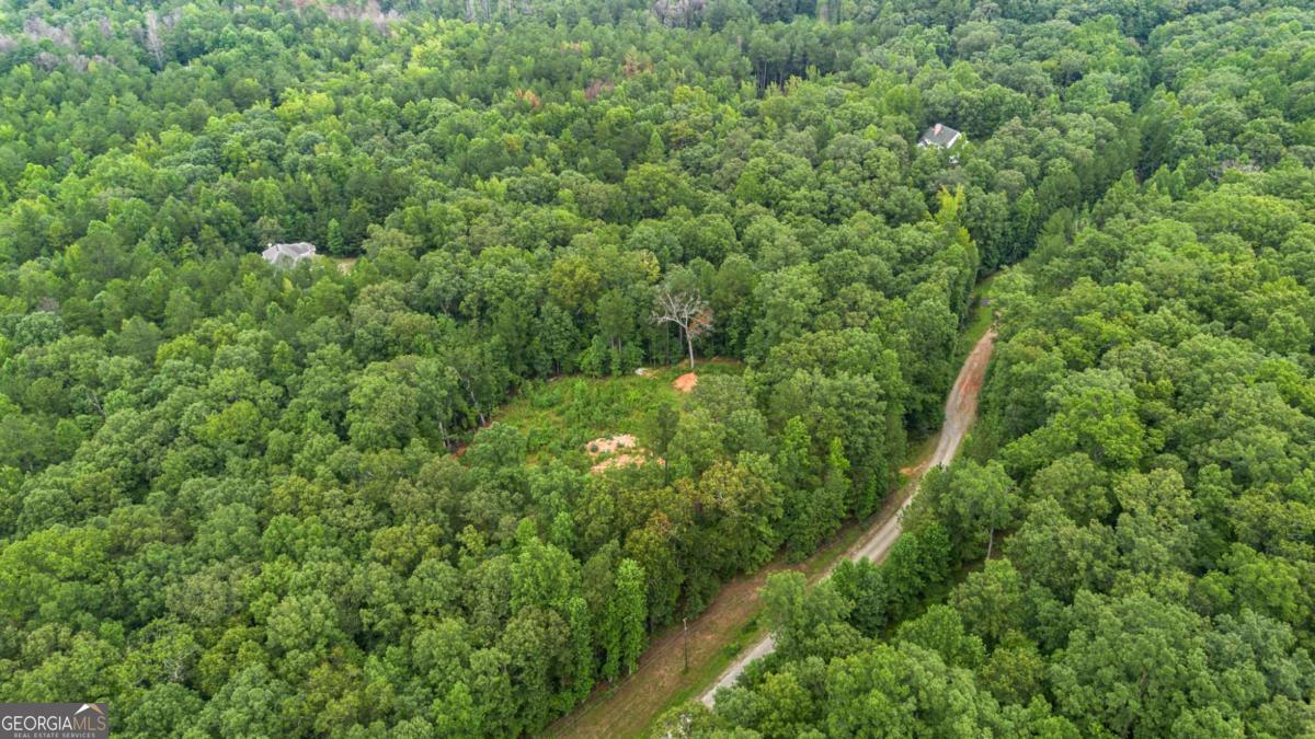 Explore this highly desirable Residential Lot and create your ideal home. Located less than 30 miles from Atlanta and Hartsfield Airport, this property spans 6.25 Acres and is prepared for construction. A soil test and survey are available, confirming the land's readiness for building. The property is connected to public city water, offering the buyer a wonderful sense of privacy along with ample space to enjoy. This presents an excellent opportunity for investors or buyers eager to realize their dream.