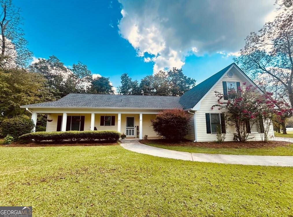 Welcome to your new home! Charming 4 bedroom 2 bath Ranch Style retreat on 3.59 acres nestled amid mature pecan trees in the peaceful McIntosh Orchards neighborhood. Spacious and Open layout: The country front porch opens into a large foyer, leading to a great room with a cozy fireplace. Chef-ready kitchen with a large walk-in pantry with plenty of space for storage and entertaining. Master Suite Retreat featuring a bonus office area (or flex space) his & her walk-in closets, double vanity and a whirlpool tub. Bonus/4th Bedroom upstairs-ideal for guests, a home office, or multi-generational living. Additional living space. Great sunroom provides extra light and connection to backyard nature. Beautiful natural surroundings with mature magnolia tress and pecan trees adding charm and privacy. Horse-friendly property. Features 2 fenced pastures for your animals. Workshop/Detached Building - great for a hobby, tools or extra storage. Handicap accessible thoughtfully designed entrance and accessibility features. This home is perfect for families who want space to roam, privacy and room for animals. Buyers who need a home office or versatile bonus space. Those looking for charm, character, and country living with city conveniences nearby. Newer Roof and HVAC approximately 3 years old