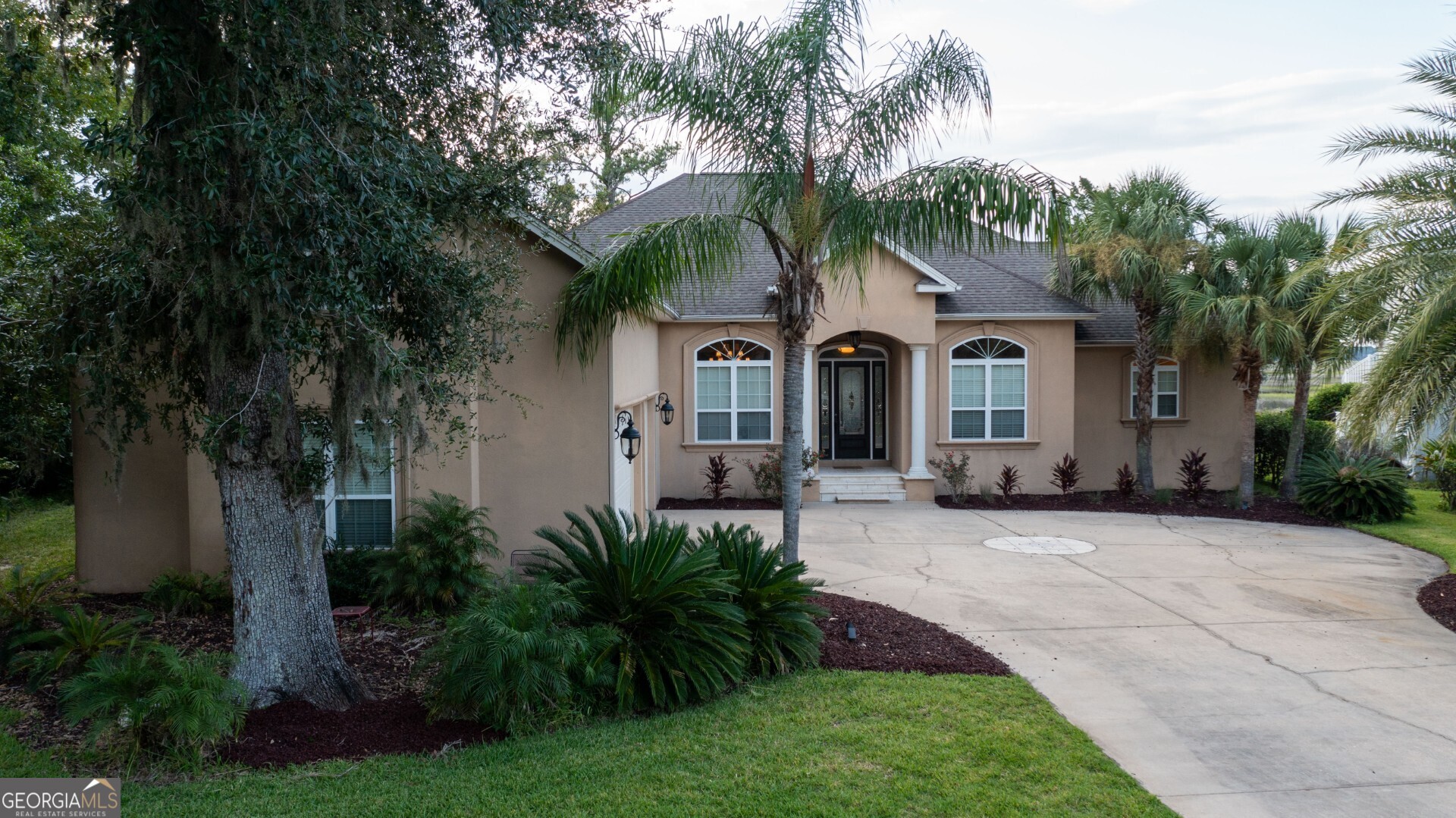 Welcome to Marsh front Luxury Living in a Prestigious Gated Golf Community! Imagine coming home to this breathtaking marsh views every day! This stunning custom-built home offers over 3,336 square feet of elegant living space, featuring 4 bedrooms, 4.5 bathrooms, plus a dedicated office. Each bedroom includes its own ensuite full bath, providing ultimate comfort and privacy. The upstairs bonus room or 4th bedroom includes a kitchenette, making it an ideal teen suite, guest suite, or flexible entertainment space. The gourmet kitchen is a chef's dream, showcasing Granite countertops, Center Island with prep sink, Stainless steel appliances, Gas stove top, Walk in pantry & Water filtration system throughout the home. Elegant tile flooring flows through the main living areas, complemented by a unique Italian-style tiled fireplace surround, adding warmth and character. The luxurious owner's suite offers: Dual walk-in closets, spa-like bath with dual vanities Limestone-tiled walk-in shower, Separate spa tub for relaxation Step outside to your private outdoor retreat-featuring a beautiful in-ground brown infinity pool that visually looks out into the marsh, creating a seamless, breathtaking backdrop. This backyard oasis also includes access to a kayak-accessible inlet, Tidal creek, which connects to the river at high tide, perfect for exploring the peaceful marsh waterways right from your own property. Enjoy peaceful mornings or stunning sunsets from the screened-in porch, where you can sip your favorite beverage while soaking in the serenity of the surrounding landscape. Located in a secure, gated golf community, this home also includes HOA amenities such as: Lawn care and irrigation (from well water), Community pool, Playground & Fitness center This exquisite Marsh front property offers the perfect blend of luxury, coastal charm, and outdoor adventure-a rare opportunity in one of Georgia's most sought-after communities