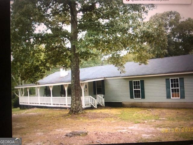 Sold "AS IS". Built on Garage, front porch and back deck. Fenced in yard. Investor special!