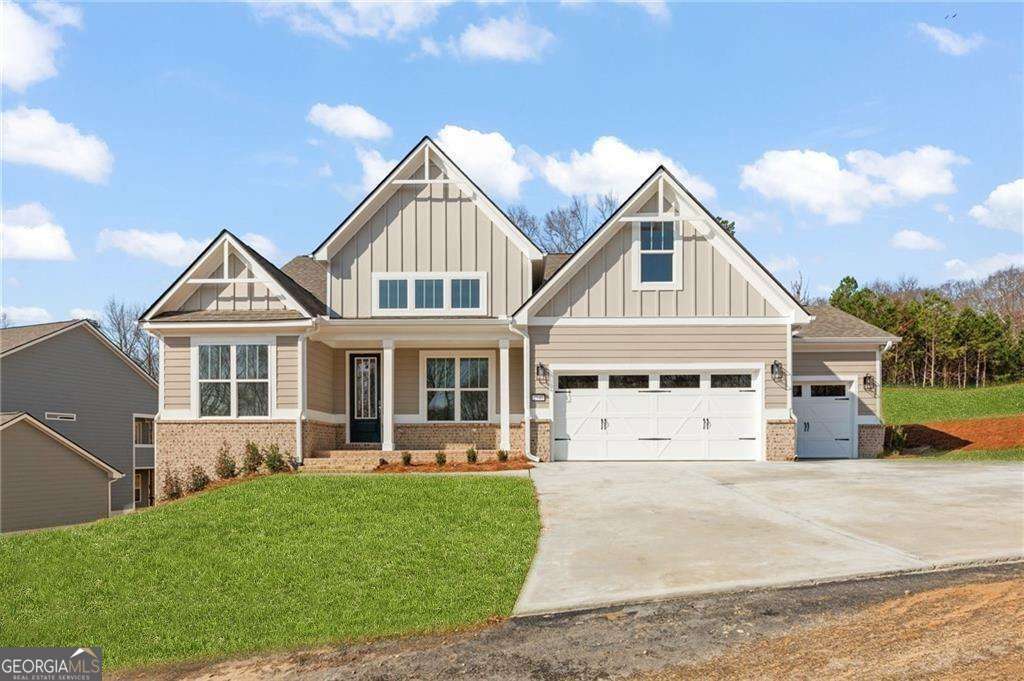 PRICE DROP! + up to 20k towards closing costs or rate buy-down with preferred lender. New Construction that is Move-In Ready! Dalton plan on Lot 6, a thoughtfully designed 3-bedroom, 3-bath home offering 2,591 sq. ft. with a full unfinshed basement. This home features a main-floor owner's suite with a spacious private bath, along with an additional bedroom and full bath on the main level for convenience. The heart of the home is an open-concept kitchen and great room, showcasing vaulted ceilings and cozy fireplace with built-ins. The gourmet kitchen is a chef's dream, complete with quartz countertops, LG appliances, center island, and breakfast area. A formal dining room and a separate office add extra functionality and style. Upstairs, you'll find a private bedroom, full bath, and a massive loft area, perfect for guests or additional living space. The outdoor living is just as impressive, featuring a covered back patio with a fireplace and a 3-car garage for ample parking and storage. As a resident of The Manor at Gainesville Township, you'll have access to an incredible amenity complex featuring a swim center with a lap pool and children's play area, lighted tennis courts, pickleball courts, a dog park, a pavilion on the great lawn, a disc golf course, and an extensive trail system. The community is adjacent to the 89-acre J. Melvin Cooper Youth Athletic Complex, known as "The Coop" including 5 baseball/softball fields, a multipurpose field, concessions, and playgrounds. This development is known for its convenient interstate access, nearby shopping, restaurants, and proximity to Northeast GA Medical Center.