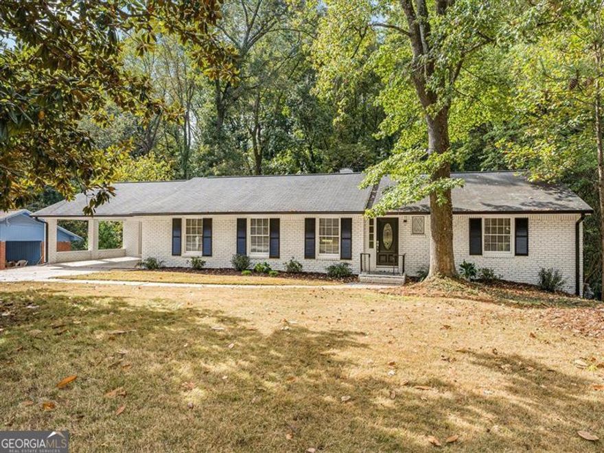 Completely remodeled ranch featuring 4 bedrooms and 4 bathrooms, including a finished basement! This spacious home offers an open-concept layout with a bright living room and a modern kitchen with white cabinets, quartz countertops, and an island extended for seating. Enjoy the outdoors with a double deck overlooking a large backyard ready for your final touches. The covered two-car carport adds convenience. Ideally located just 5 minutes from Hartsfield-Jackson Atlanta International Airport and only 20 minutes from Downtown Atlanta, this move-in-ready home combines comfort, style, and accessibility.