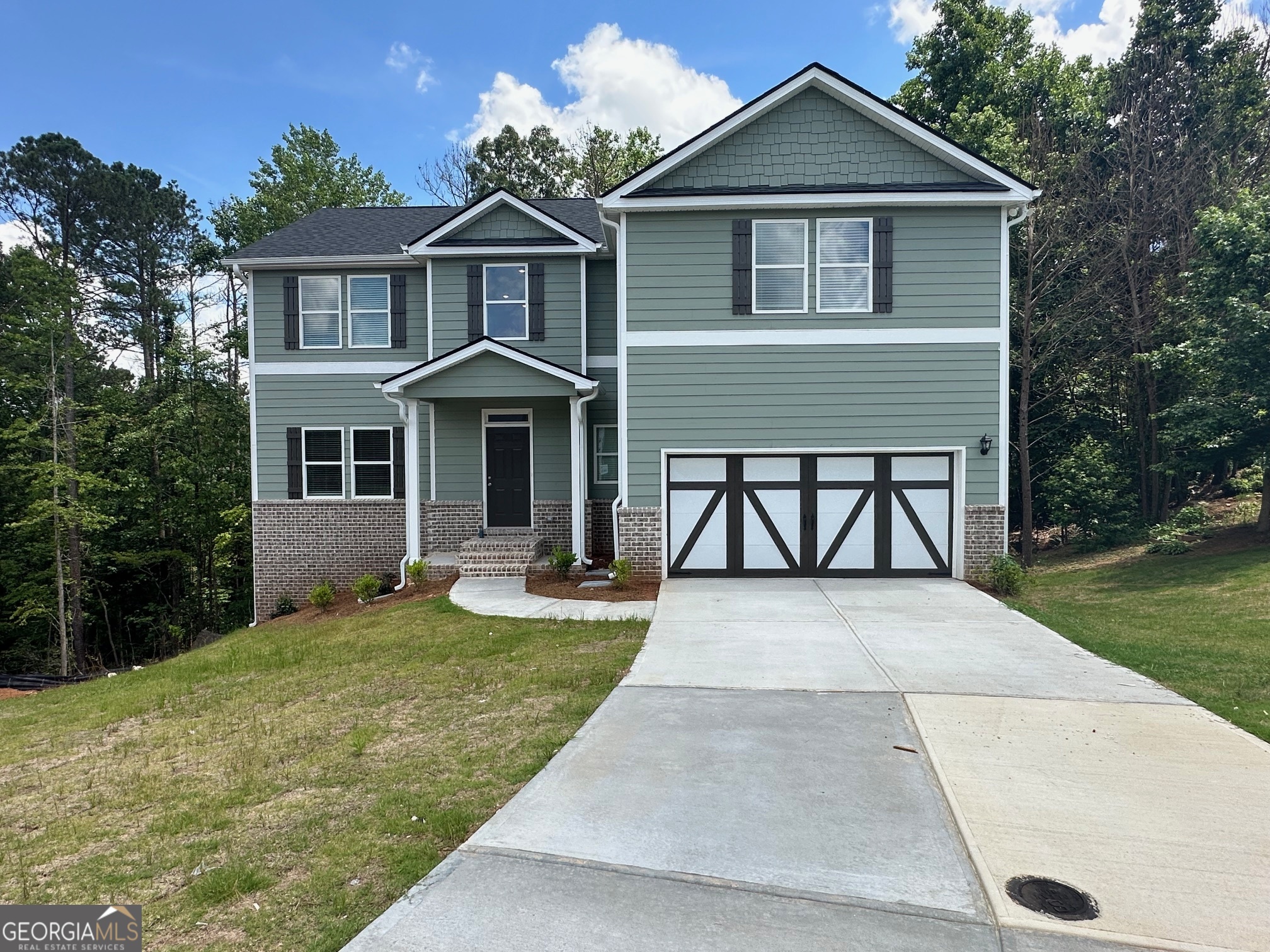 PRICE IMPROVEMENT!!! Search no further...Welcome home to Timberlands in Dallas, GA. Don't miss out, only a few opportunities left to make this great location, home and community yours in 30 days or less. Hurry for this newly constructed Adam plan on an unfinished daylight walk-out basement is priced to sell and won't last long. Enter into a two-story foyer with a separate dining room and living room. This open-concept floor plan design is great for entertaining family and friends in the great room with views and easy access to the kitchen and breakfast area! Features include 36" soft-close cabinets, stainless steel appliances, LED lighting throughout, granite countertops in the kitchen and full bathrooms, LVP flooring throughout the main floor plus wet areas, plush textured carpeting in bedrooms and closets to name a few. Upstairs the large primary ensuite has lots of natural lighting with dual vanity, separate shower, tub, and water closet. Secondary bedrooms are spacious with sizable closet. Great Homebuyer incentive available with the use of the affiliated mortgage lender. Please note some photos are stock images used for illustration purposes only.