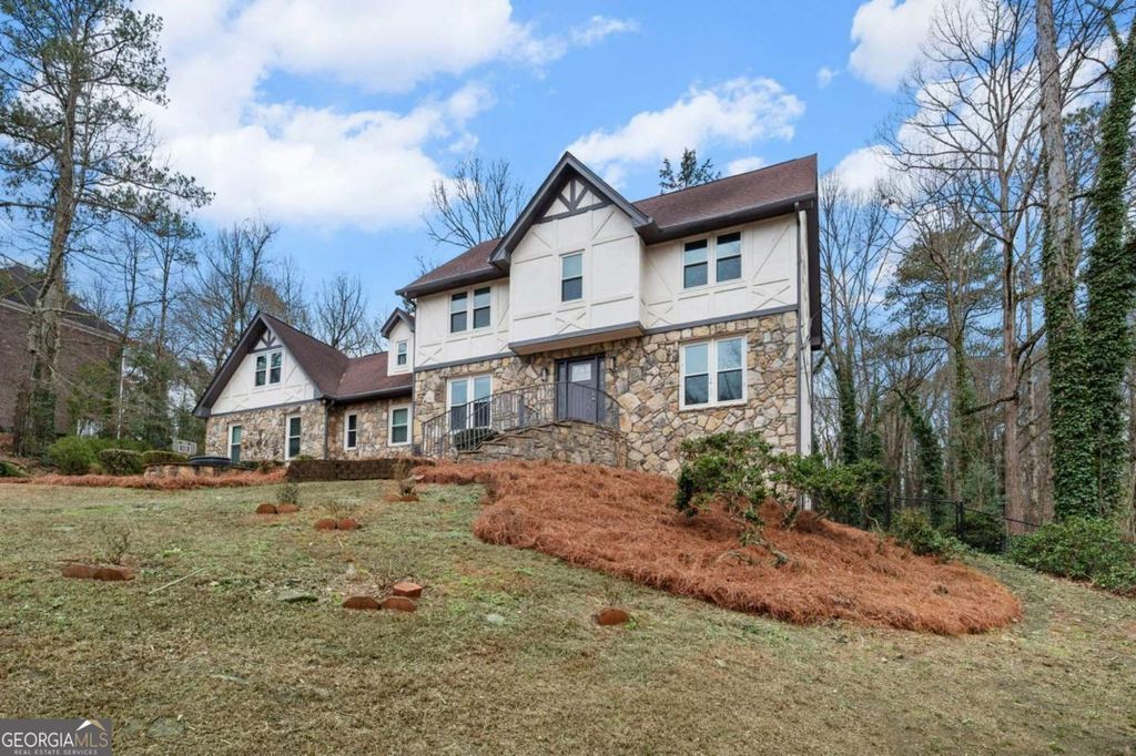 Photo of 4947 Castlewood Drive SW, Lilburn, GA 30047 (MLS # 10679524)