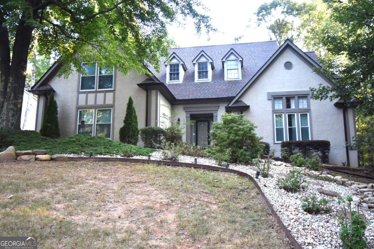 Don't Miss This Stunning Home - Here Today, Gone Tomorrow! This beautiful home offers the perfect blend of elegance, comfort, and modern updates. Step inside to find gleaming hardwood floors and soaring ceilings that create a bright, open feel throughout. The spacious layout includes: A newly renovated kitchen with modern finishes, large main-level bedroom - ideal for an in-law suite, vaulted formal living room or study, elegant formal dining room, great room with built-in bookshelves and a warm fireplace, sunroom - perfect for relaxing year-round, expansive primary suite with private en-suite bath, two large secondary bedrooms upstairs with a Jack-and-Jill bathroom, convenient upstairs laundry room and more... Recent updates include the renovated kitchen, tankless water heater, new roof (November 2024), and main-level HVAC system (2023) for added peace of mind. Located in a vibrant community with outstanding amenities: tennis courts, swimming pool, playground, clubhouse, and a picturesque lake - there's something here for everyone!