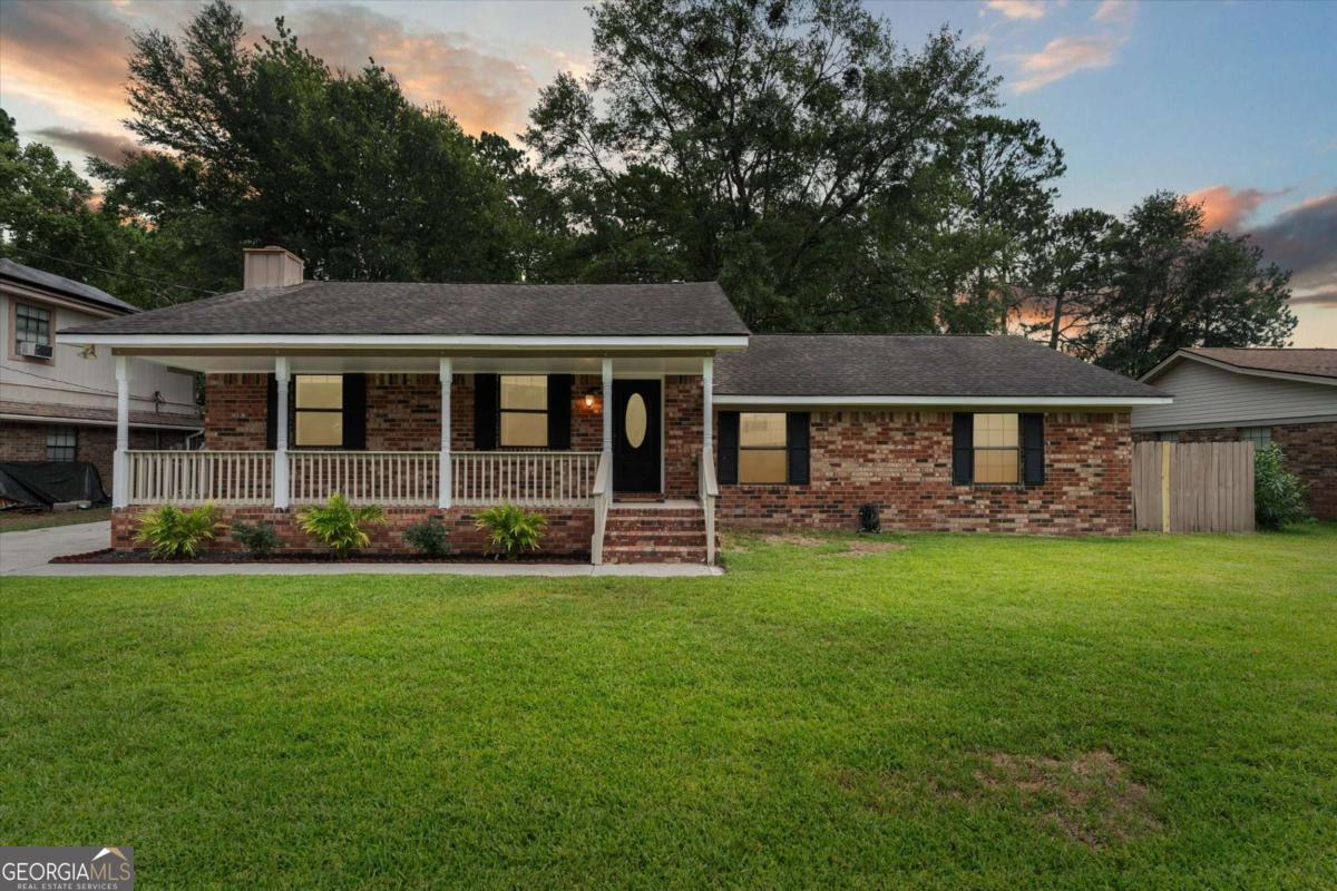 A HOME full of charm and NO HOA! This beautifully updated brick home blends style and comfort, starting with a dreamy front porch that welcomes you in. Step inside to brand new LVP flooring, soaring cathedral ceilings, and a cozy fireplace in the spacious living room. The stunning kitchen boasts quartz countertops, freshly painted cabinets, and sleek new hardware. Hall bathroom vanity has also been updated with quartz countertops, new hardware and light fixture. You'll find three roomy bedrooms, including a primary suite with a private ensuite bath. Stay cool this summer with a new HVAC! New custom steps lead you out back where you can enjoy a large fenced in yard and an oversized patio-perfect for entertaining-and a powered outbuilding ready for your special touch, ideal for a studio, workshop, storage, etc... Conveniently located with quick commute to many dining and shopping options! Don't miss this one!