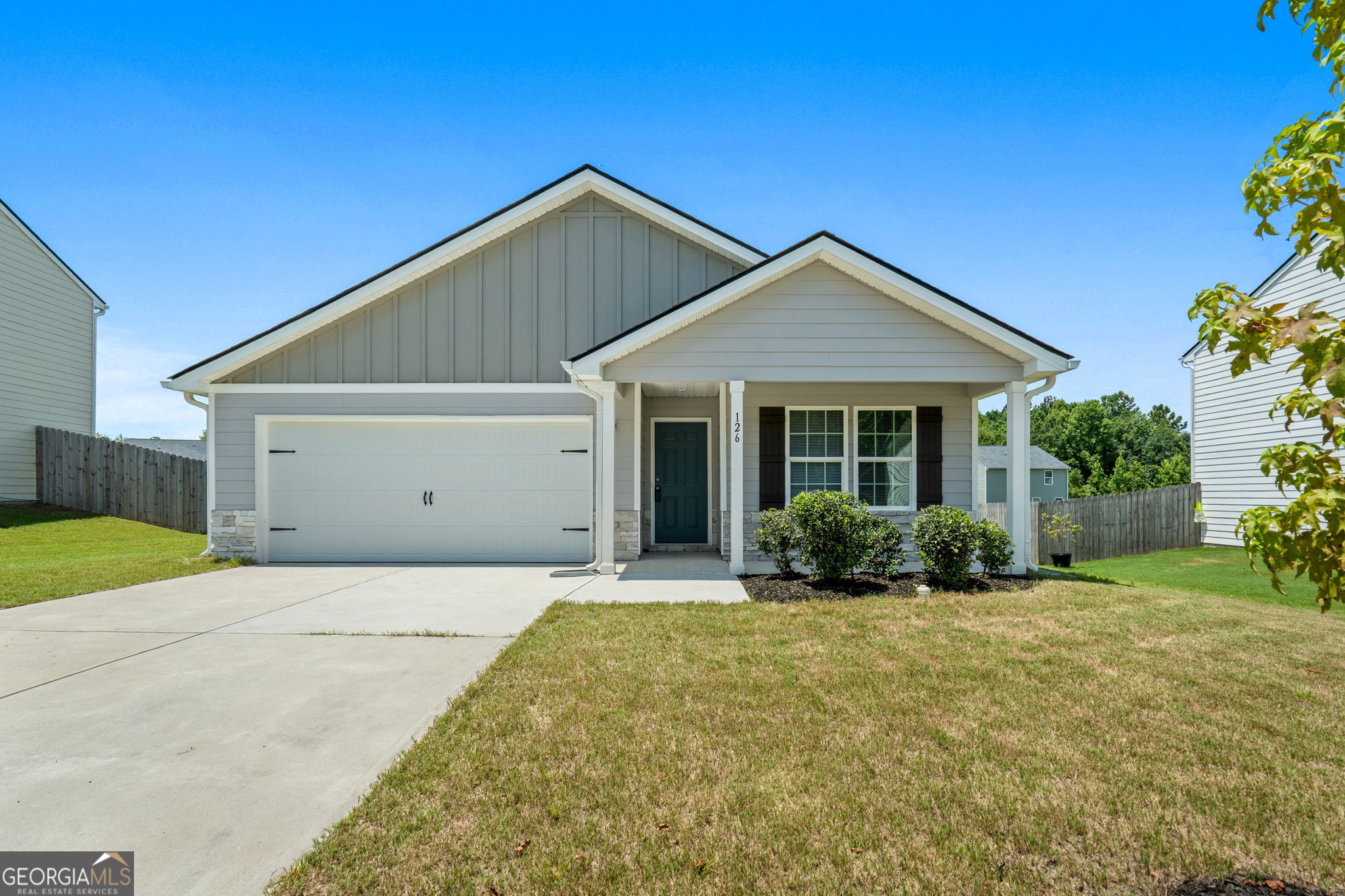 Welcome Home! Built less than 3 years ago, this charming 4-bedroom, 2-bath ranch still has that brand-new feel. From the moment you arrive, you'll love the curb appeal-with a cozy covered front porch and a spacious 2-car garage. Inside, the open-concept great room flows effortlessly into the modern kitchen. The spacious primary suite is tucked away for privacy and features a large walk-in closet and a luxurious private bath with dual vanity sinks. Three additional bedrooms and a second full bath offer flexibility for guests, a home office, or a growing family. Impeccably maintained and truly move-in ready, this home qualifies for USDA 100% financing-a fantastic opportunity for eligible buyers looking to purchase with no money down. Don't miss out on this opportunity!