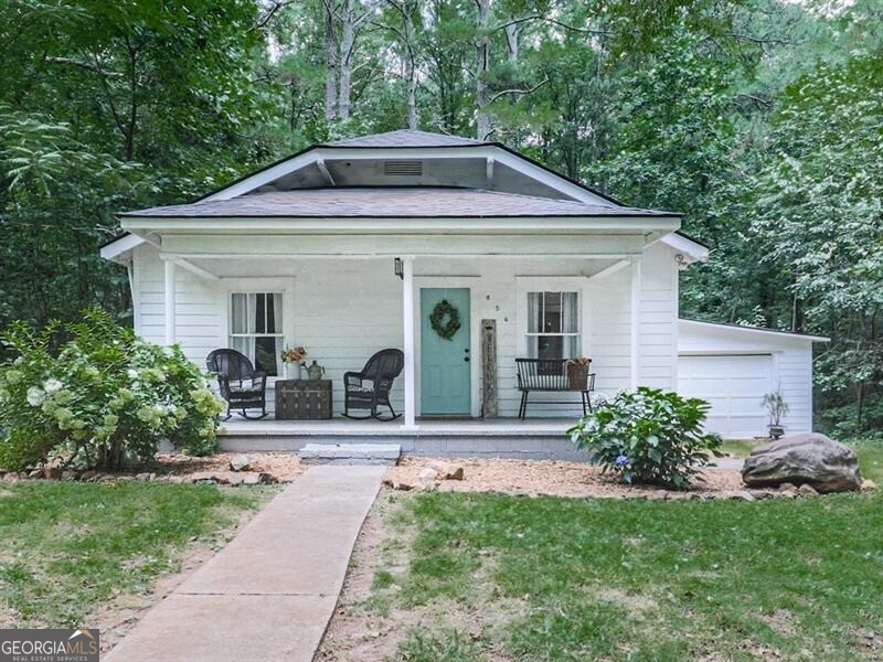 Charming 1945 cottage with modern updates, tucked away on a quiet dead-end street for added privacy. This 3-bedroom, 1-bath home features a spacious layout that blends vintage charm with modern comfort. Recent upgrades include a new roof, interior and exterior paint, luxury vinyl plank flooring, countertops, appliances, tub, ceiling fans, light fixtures, deck, and front door. The cozy kitchen offers both style and functionality, while the deck and added garage provide great outdoor living and storage. Conveniently located near the highway, this home offers the perfect mix of seclusion and accessibility.