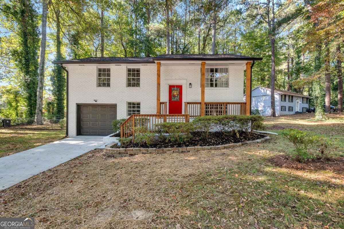 Gorgeous Renovated Home in Marietta, Georgia. Discover this stunning home nestled on a spacious lot surrounded by trees, perfect for family gatherings. Located in a beautiful community, this property offers a renovated kitchen with an open-concept design, ideal for creating lasting memories with loved ones. The home features new flooring and carpet, along with a fresh coat of paint throughout, providing bright and inviting spaces ready for your personal touch. With four bedrooms and three bathrooms, there is ample space for your family's needs. Do not miss out on this amazing opportunity ,schedule an appointment today to see your future home! CALL ME TO ASK HOW TO PURCHASE THIS HOME WITH JUST 1% DOWN PAYMENT.