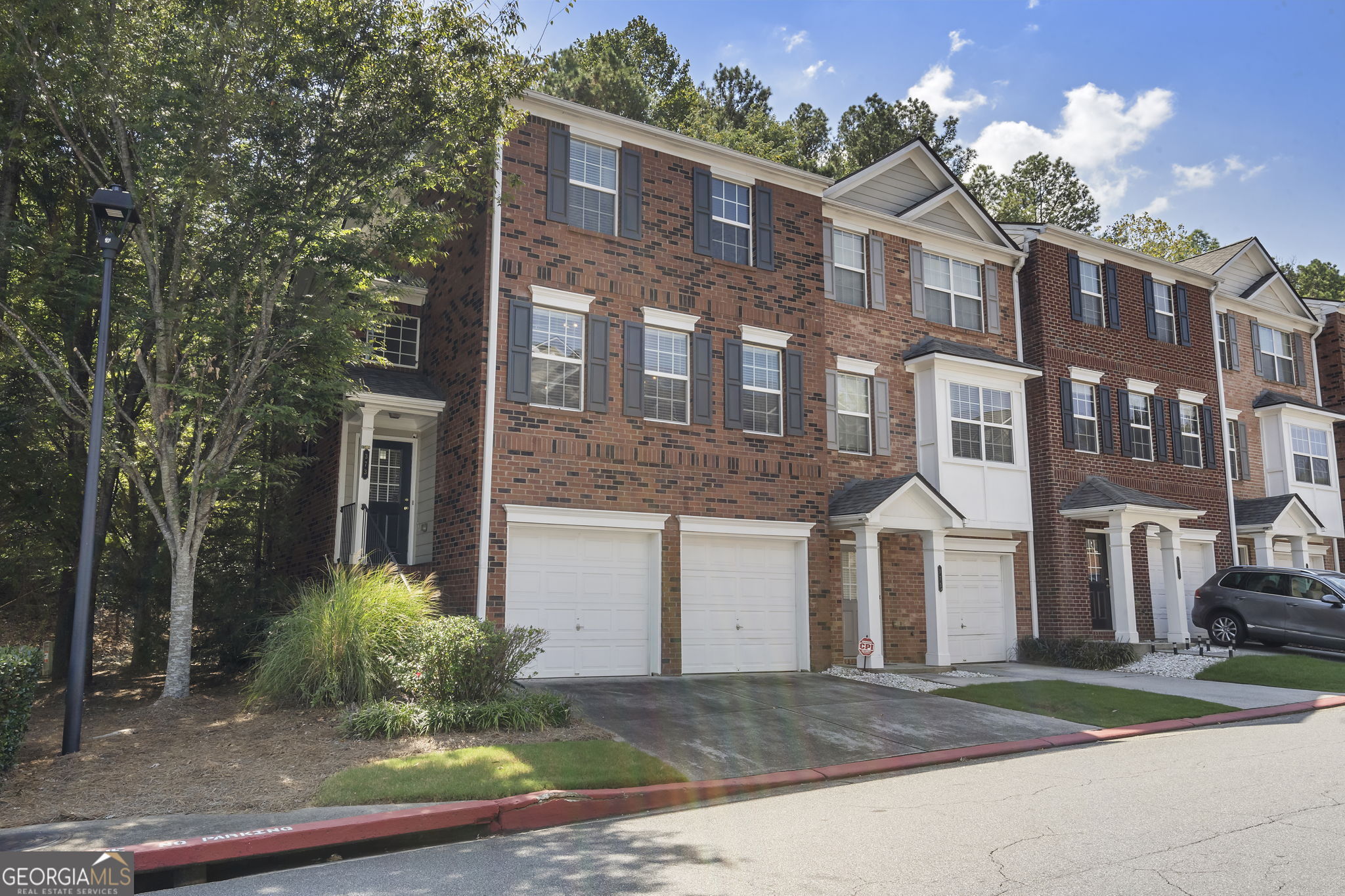 Beautiful End Unit in Heritage Park! Welcome to this well-maintained end-unit located in the highly sought-after gated community of Heritage Park. Offering 4 bedrooms and 3.5 bathrooms, this home features a versatile layout with a guest suite on the first level, and another on the top level ,plus 2 extra bedrooms. Enjoy the convenience of a double garage and plenty of guest parking. The community amenities include a gated pool, while the low HOA fees covers the exterior maintenance, landscaping, water, trash services and termite control -providing true peace of mind and easy living. Perfectly situated just minutes from shopping, fine dinning, entertainment and quick access to I-75 and I-575 , this home combines comfort, convenience and location. Schedule your tour today and be right at the center of a vibrant Kennesaw area.