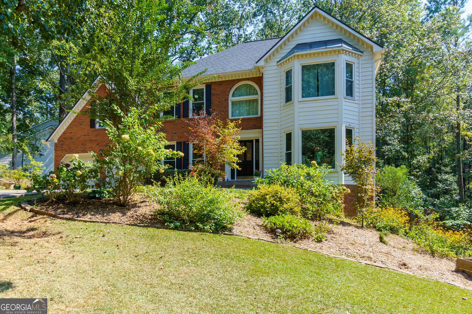 Welcome home! 2206 Heritgae Trace Drive is a beautifully maintained home that's been freshly painted and is completely move-in ready! Located in the coveted Timber Ridge/Dodgen/Walton school district, this home sits on nearly an acre of lush, landscaped grounds in a peaceful, nature-filled setting. Step inside to a sun-filled interior featuring hardwood floors, a spacious living room with a cozy fireplace and wet bar, and an updated kitchen with stainless steel appliances, butcher block counters, and a walk-in pantry. The oversized primary suite offers a private sitting area, walk-in closet, and a spa-like bath for the perfect retreat. Relax year-round on the screened-in porch, overlooking a private wooded backyard with tranquil creek views and daily deer sightings-a true nature lover's dream! The fenced yard provides both privacy and functionality. This East Cobb gem combines comfort, style, and an unbeatable location. Seller is offering $10,000 toward closing costs with an acceptable offer-don't miss this incredible opportunity!