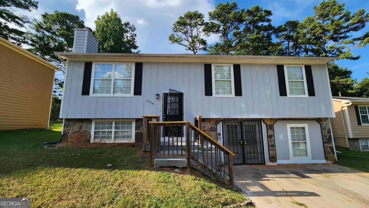 Make a great deal even better with Massive savings through special loan programs with the Preferred Lender Envoy Mortgage with Aubrey Wilcox! Ask the Listing Team for the introduction for up to 100% Financing or even interest rates in the 4s! This spacious 3-bedroom, 2.5-bath home in Stone Mountain's established Emerald Pines community offers great potential with some minor updates and personal touches. The main level features a large living room with a cozy fireplace, a separate dining area, and an eat-in kitchen with ample cabinet space. Upstairs, the oversized primary suite includes a private bath and walk-in closet, while the secondary bedrooms provide flexibility for guests, work-from-home space, or family needs. The level backyard is perfect for outdoor gatherings or weekend relaxation. Conveniently located near schools, shopping, and Stone Mountain Park, this home offers easy access to Hwy 78 and I-285, making it ideal for commuters or anyone seeking both value and location.