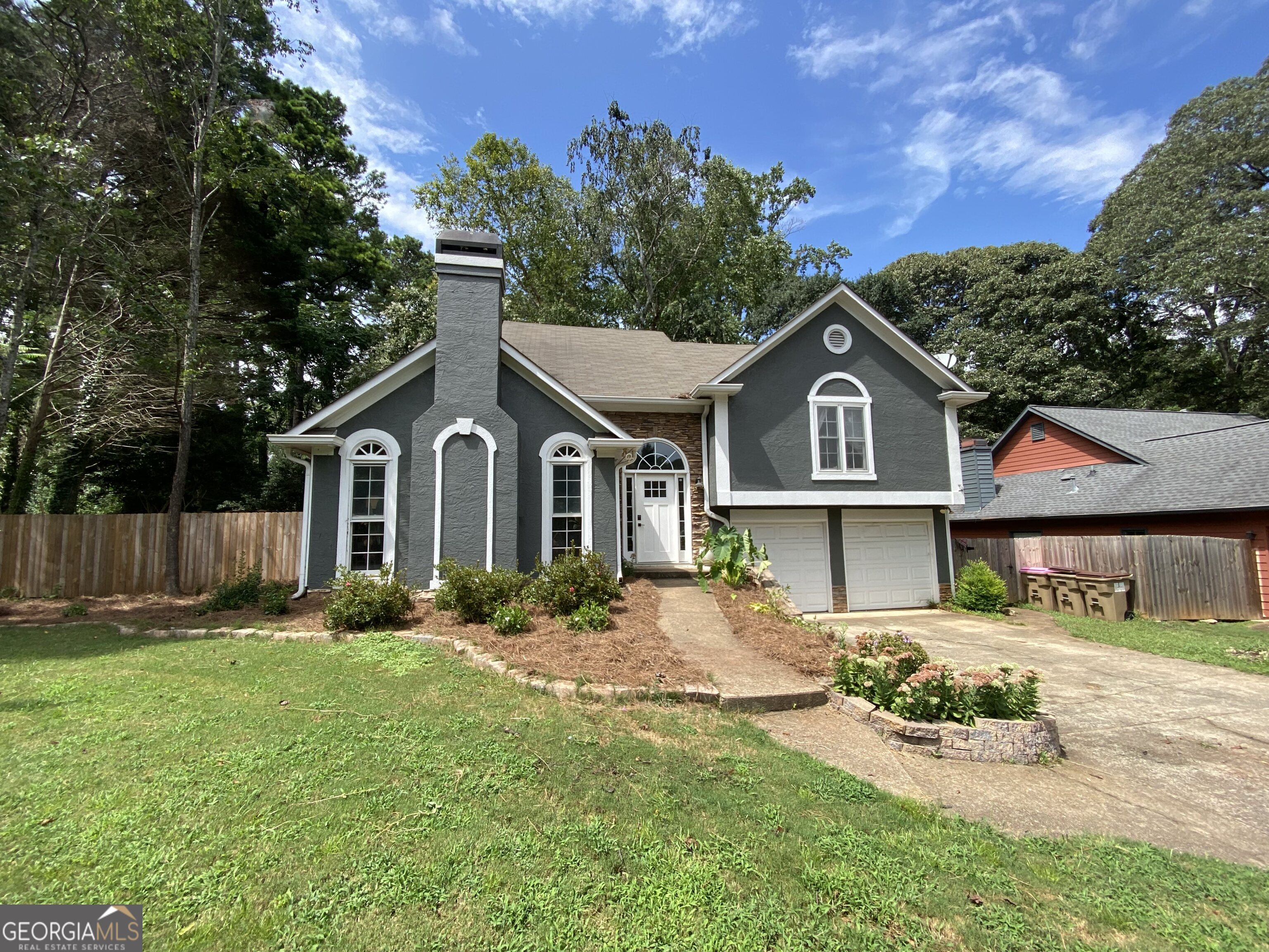 Welcome to this charming, turn-key 4-bedroom, 2.5-bath home in the East Cobb community. Enjoy neighborhood amenities like swim, tennis, and a playground, all within an beautiful established neighborhood. Recently renovated, this home features a private suite with an updated bath, a newly built wood deck, and a spacious, fenced backyard complete with a producing garden. A brand-new 8x12 storage building offers plenty of space for your outdoor needs. Ideally located just minutes from downtown Woodstock, Cobb County schools, shopping, and easy highway access - this home is move-in ready and waiting for you!