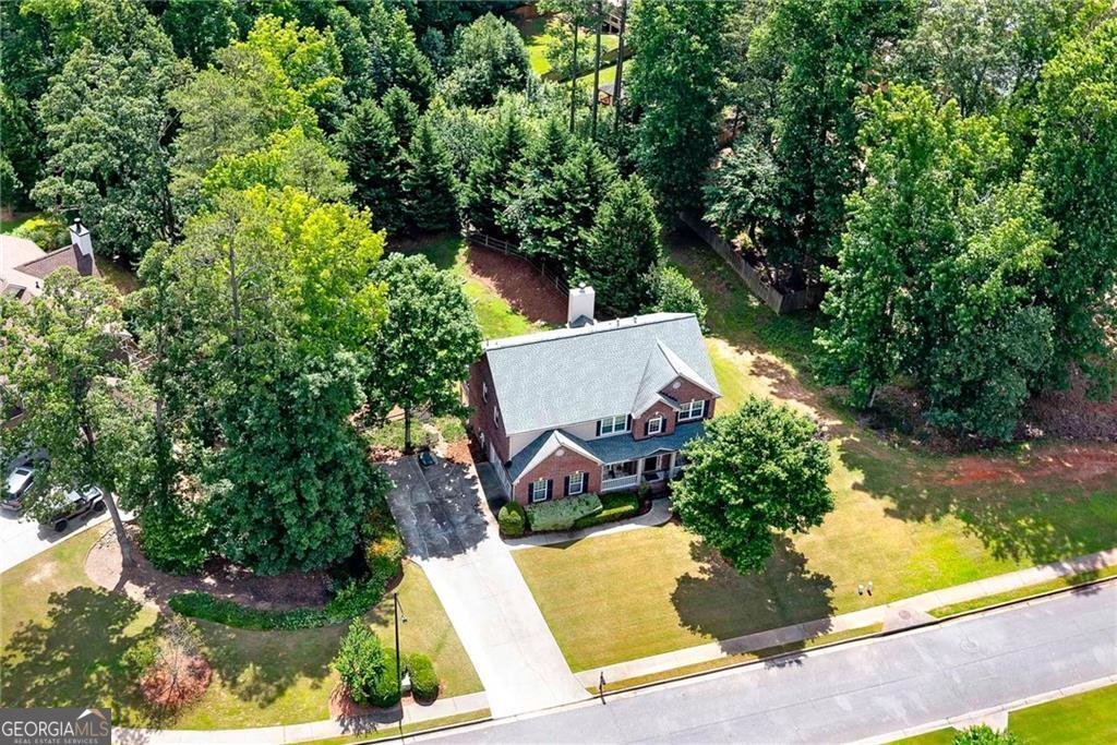 Motivated Seller! Don't Miss This Opportunity! Welcome to 1120 Bagwell Drive, a beautifully maintained home located in the quiet and charming Belleterre Subdivision, one of the most desirable neighborhoods within the highly acclaimed Kennesaw Mountain High School district. Perfectly positioned on a spacious half-acre corner lot, this 4-bedroom, 3.5-bathroom home offers exceptional indoor and outdoor living. Inside has a grand entryway that opens to a formal living room, dining room, den, and a dedicated office space. The open-concept kitchen, updated in 2023, features a clear view into the living area and includes new stainless-steel appliances all installed in 2023. Upstairs has a luxurious owner's suite with a sitting area and a spa-like bath complete with double vanities, a tiled shower, and a separate soaking tub. Custom shelving added in 2022 enhances the owner's suite closet and laundry room. Relax and unwind on the screened-in deck, freshly painted in 2023. Enjoy the finished basement, which includes a full bath, theater room, family room, workshop, fitness/storm room, and ample storage space. Additional upgrades include a new roof (2018), all windows replaced (2016), Nest thermostats for smart climate control, storm doors added in 2024, a new garage door and LiftMaster opener with camera (2022), and a SafeRack storage system installed in the garage (2019). As a rare added bonus, this home includes a 2-year home warranty offering peace of mind for your investment. Conveniently located near parks, shopping, dining, major highways, Kennesaw Mountain National Battlefield Park, and the Marietta Square. Schedule your private tour today!